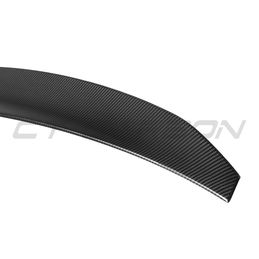BMW G60 5 Series and I5 carbon fibre kit by CT Carbon, featuring a sleek aerodynamic spoiler in glossy black finish.