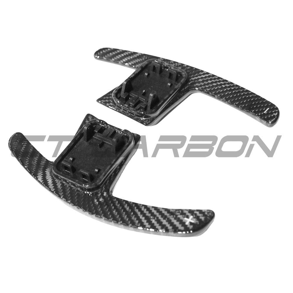 BMW GXX F40 carbon fibre shifter paddles by CT Carbon, close-up view of sleek, lightweight racing-style gear shift accessories.