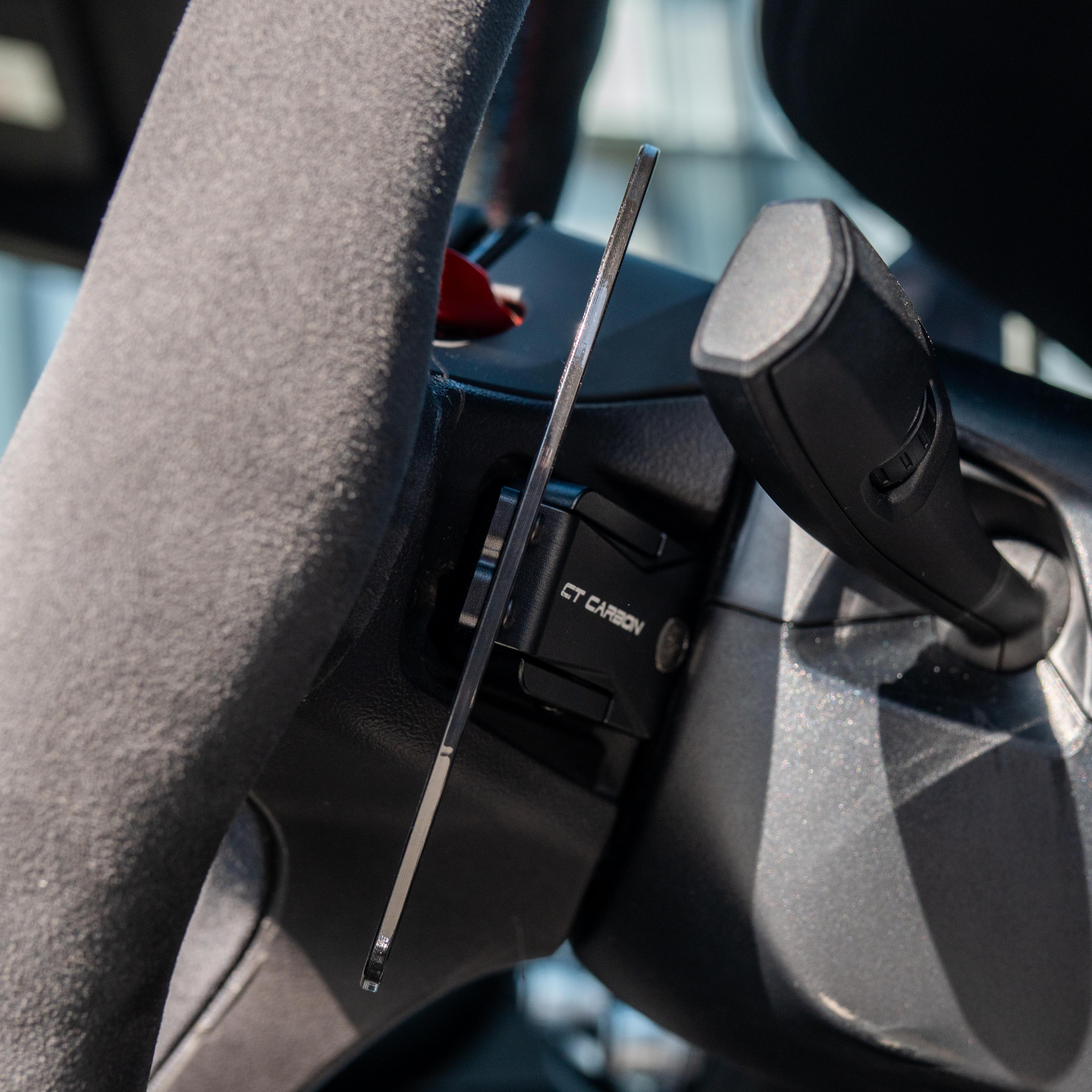 BMW Gxx carbon fibre magnetic shifter paddles by CT Carbon, close-up view showing sleek carbon texture and magnetic attachment.