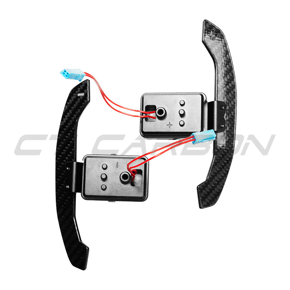 BMW Gxx carbon fibre magnetic shifter paddles by CT Carbon, showcasing sleek, lightweight racing-inspired accessories for the vehicle.