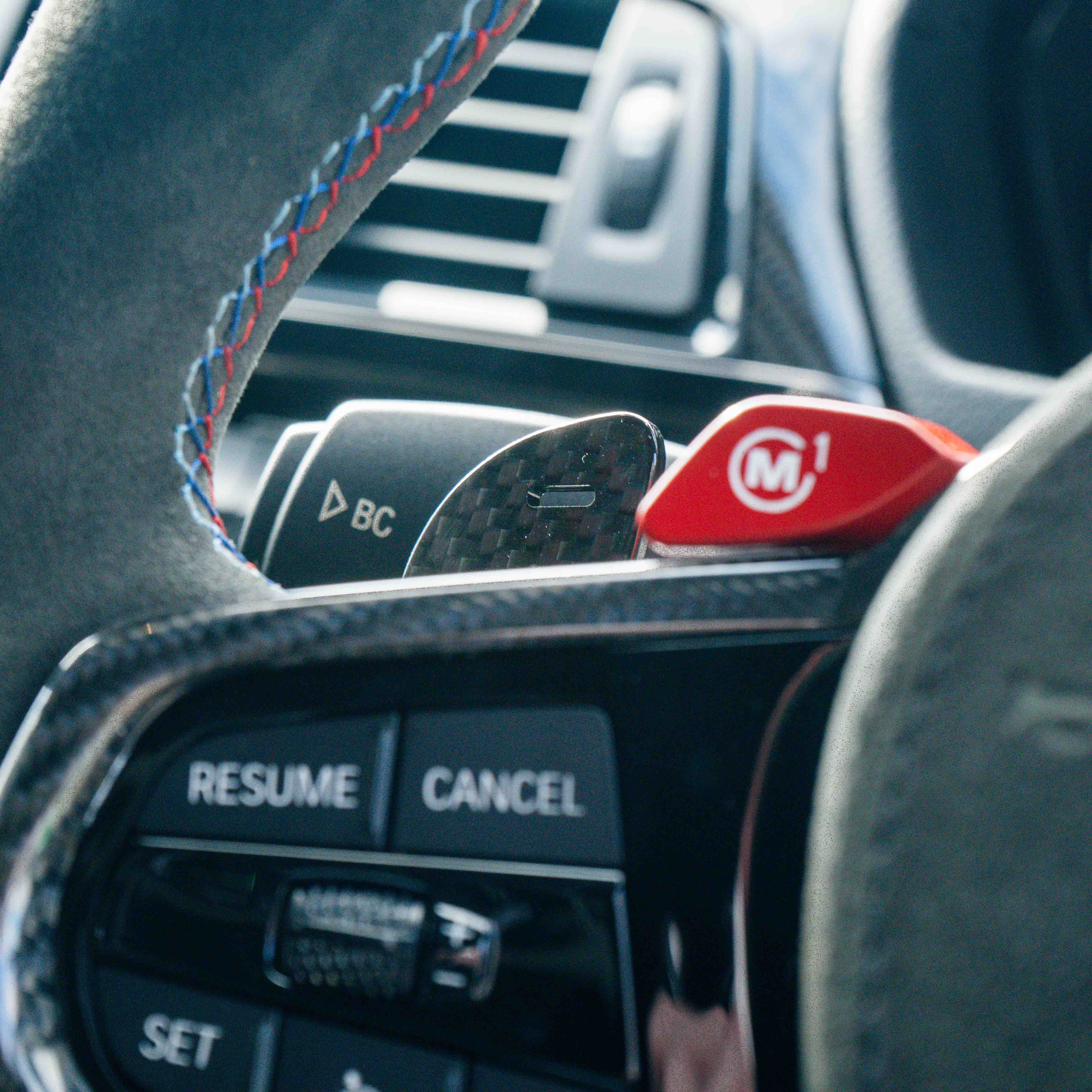 BMW Gxx carbon fibre magnetic shifter paddles by CT Carbon, showing sleek, lightweight design for sporty steering control accessories.