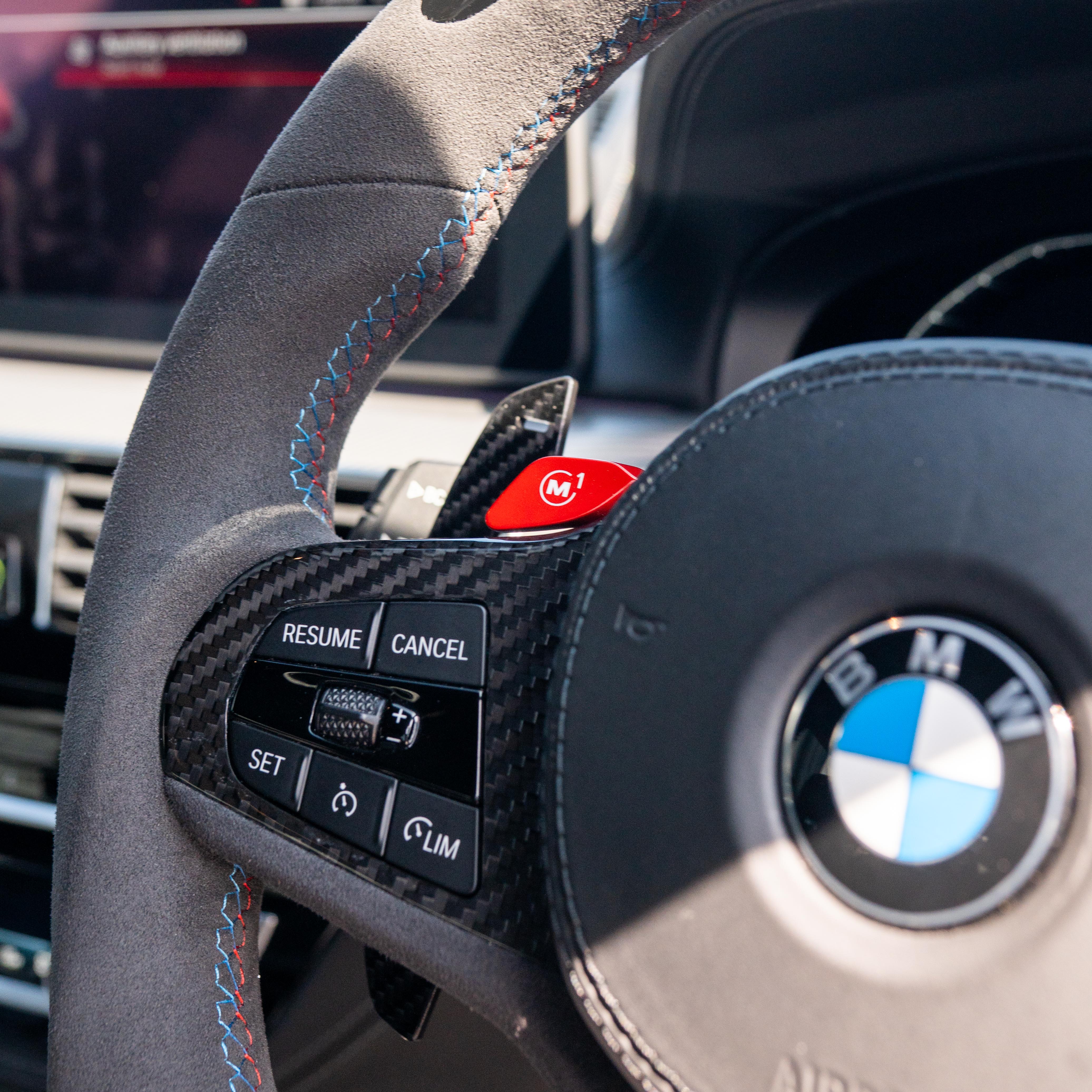 BMW Gxx carbon fibre magnetic shifter paddles by CT Carbon, close-up of sleek, lightweight racing-style accessories for BMW vehicles.