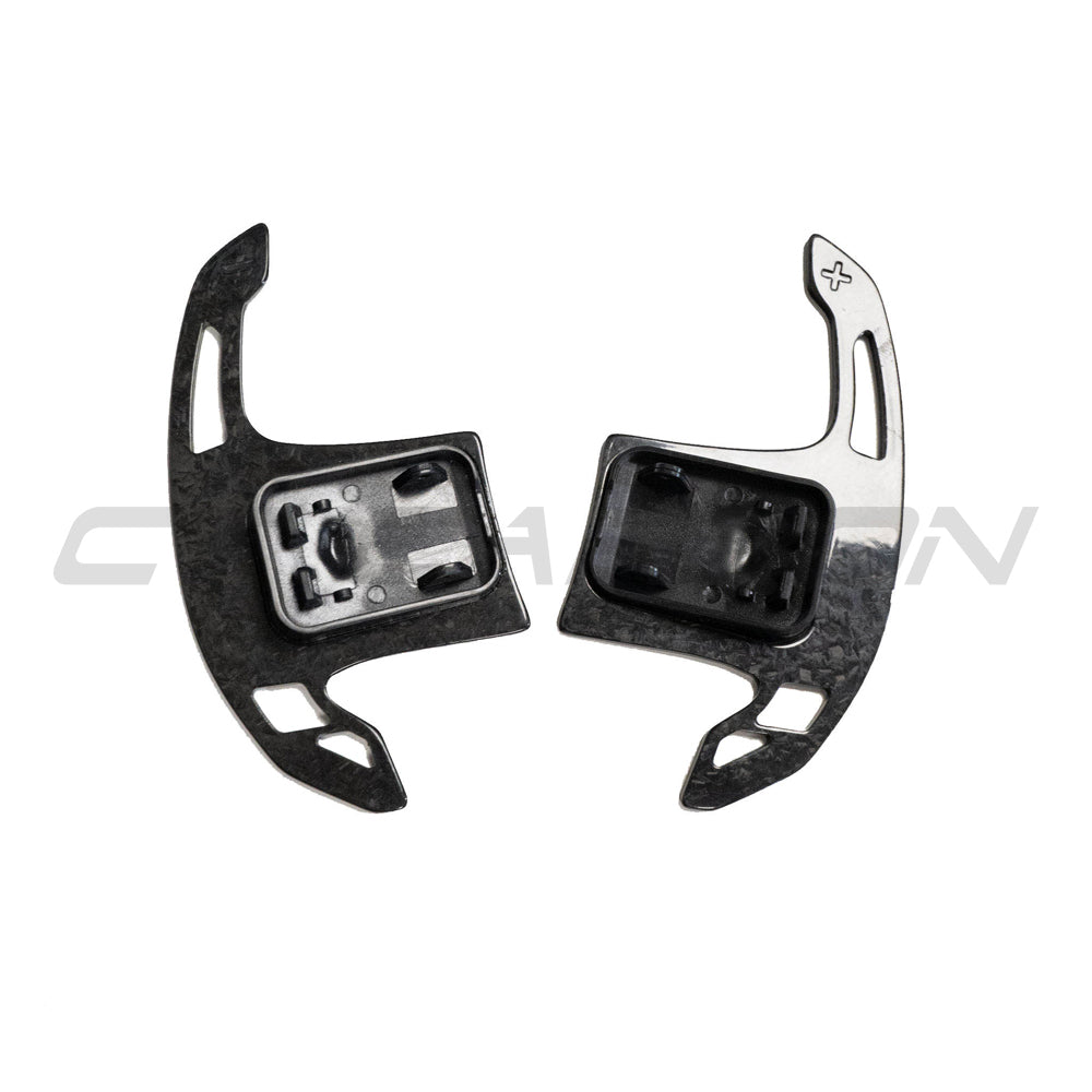 BMW Gxx forged carbon fiber shifter paddles by CT Carbon, close-up view showing premium forged carbon fiber texture.
