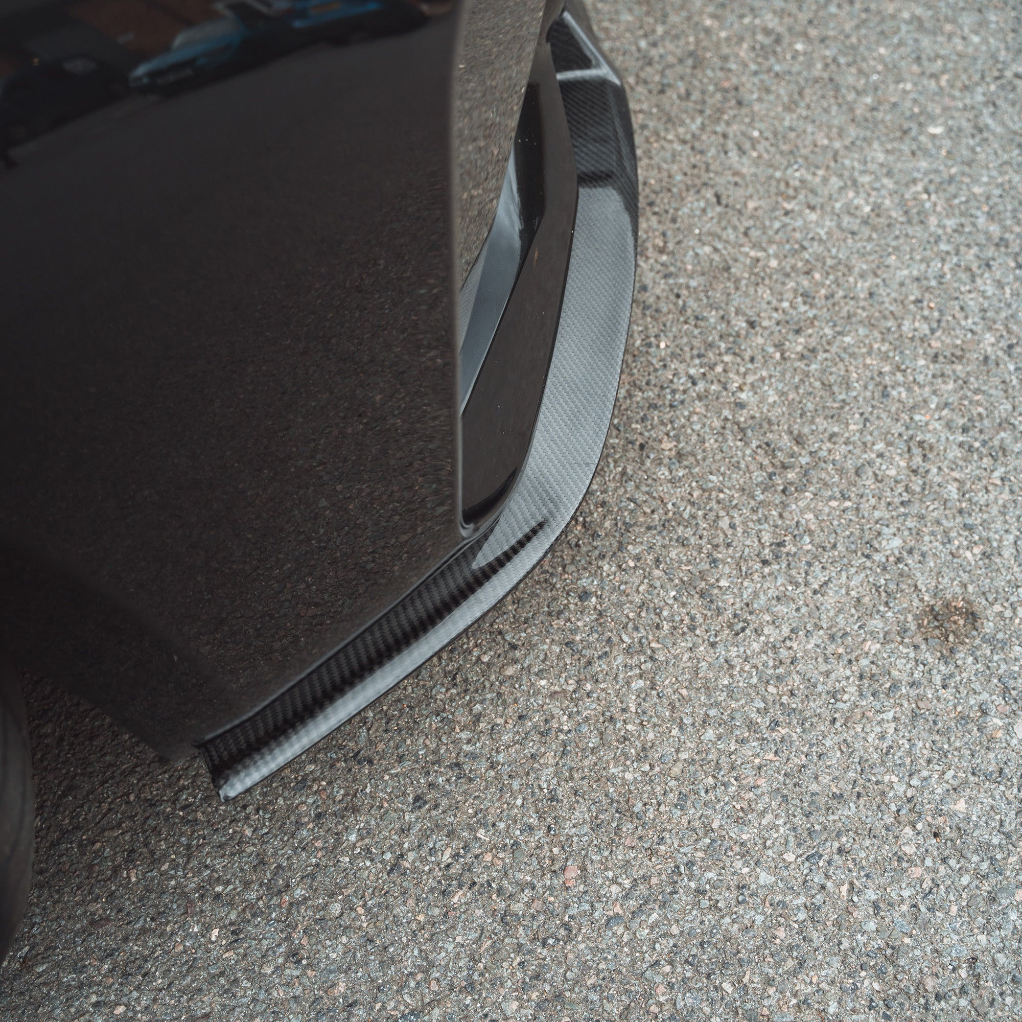 BMW M2 F87 N55 carbon fibre splitter V2 by CT Carbon, featuring a sleek front splitter with a carbon fibre finish and aerodynamic design.