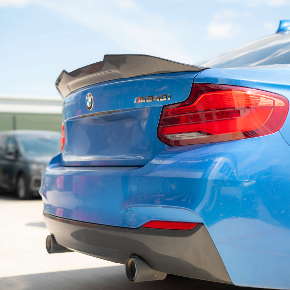 BMW M2 M2C F87 F22 carbon fibre ducktail spoiler by CT Carbon, featuring sleek design and textured carbon fiber surface.