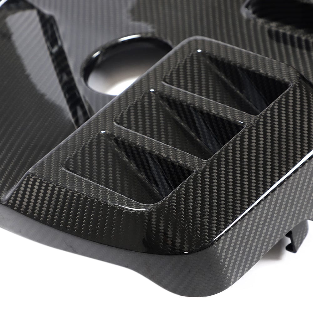 BMW G81 M3 Touring full carbon fiber engine dress-up kit by CT Carbon, featuring sleek carbon fiber engine covers.