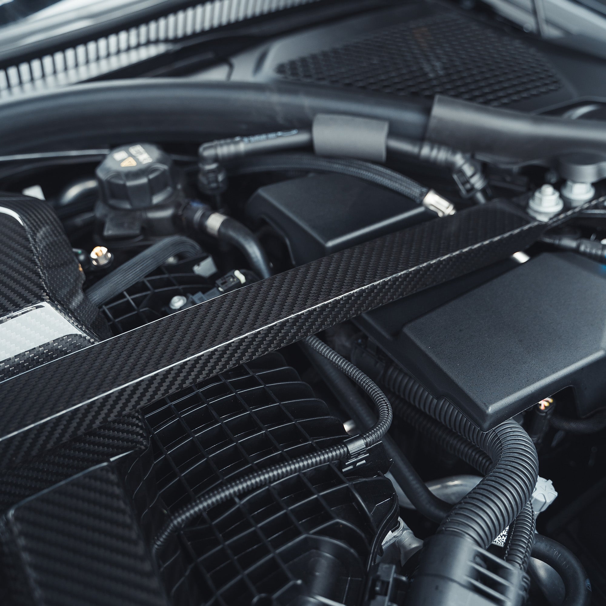 BMW M2, M3, M4 G87, G80, G81, G82, G83 Carbon Fibre Engine Dress Up Kit by CT Carbon, showing sleek carbon fibre components.