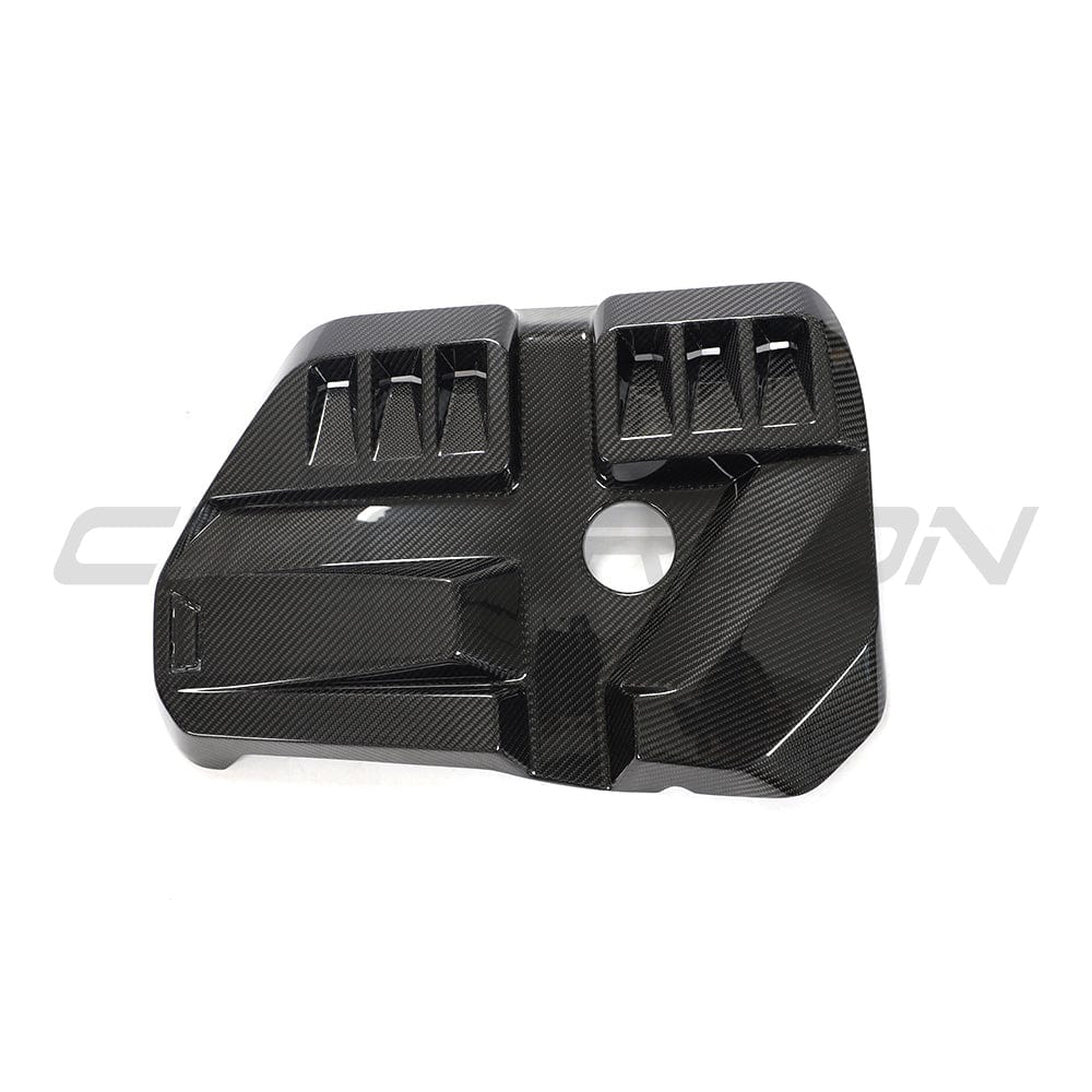 BMW M2, M3, M4 G87, G80, G81, G82, G83 carbon fiber engine dress-up kit by CT Carbon, close-up of the sleek carbon fiber components.