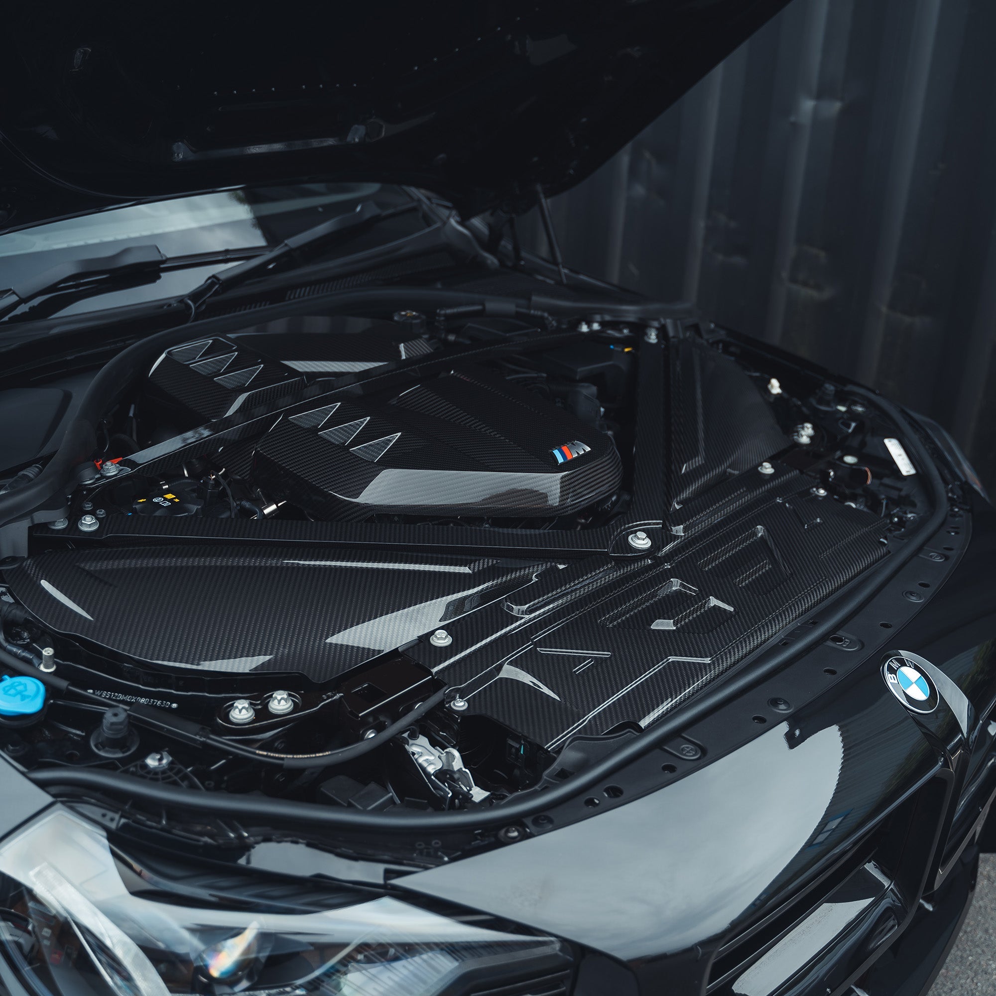 BMW M2, M3, M4 G87, G80, G81, G82, G83 Carbon Fibre Slam Panel Cover by CT Carbon, close-up view of the lightweight accessory.