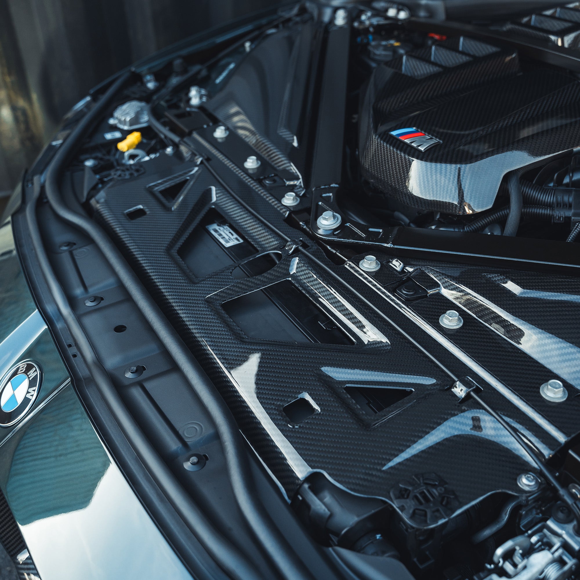 BMW M2, M3, M4 G87, G80, G81, G82, G83 carbon fibre slam panel replacement by CT Carbon, showcasing sleek, lightweight automotive accessory.