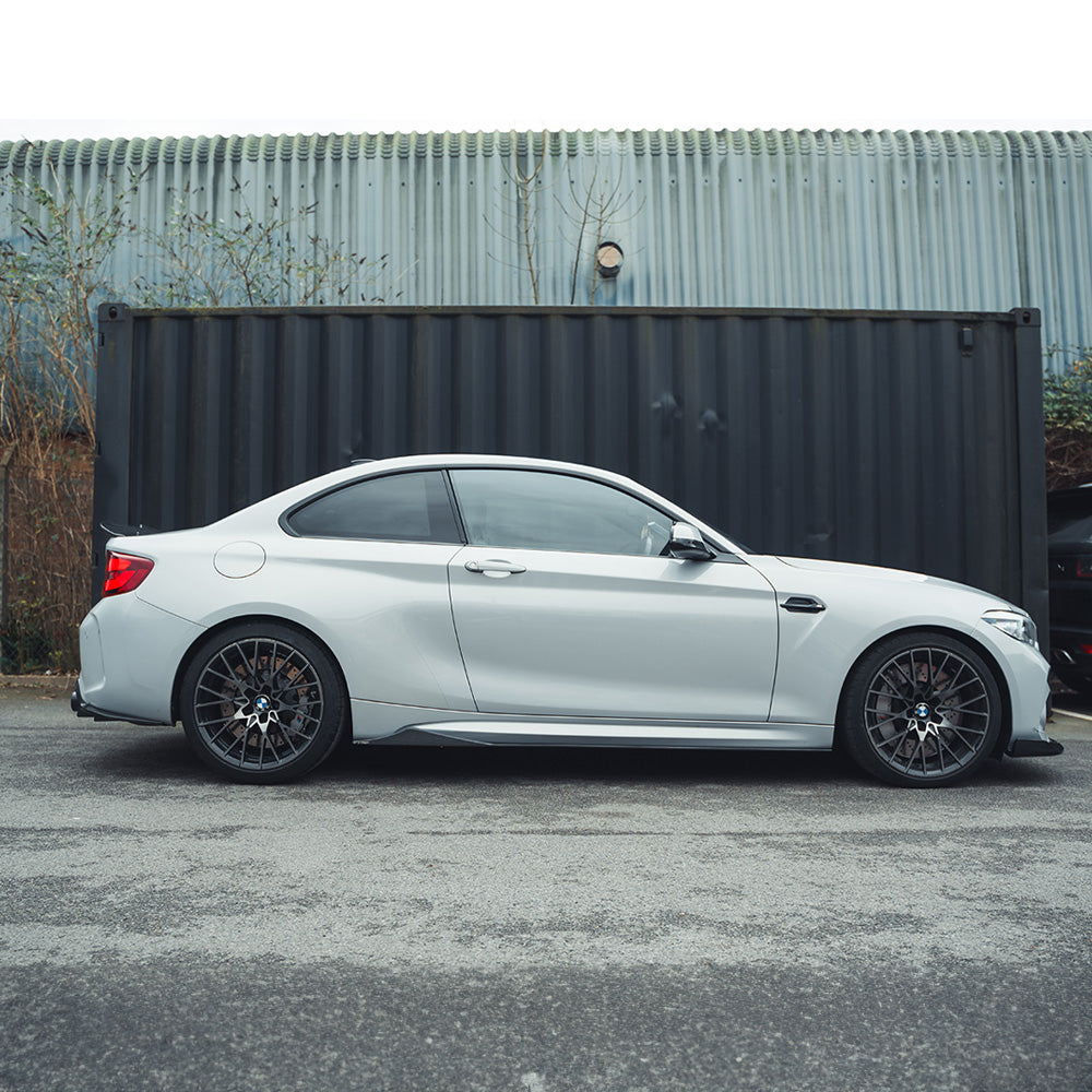 BMW M2 M2C F87 carbon fiber side skirts by CT Carbon, V2 style, featuring sleek, lightweight design and carbon fiber finish.
