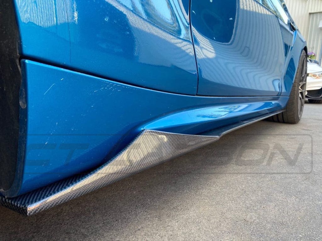 BMW M2 F87 carbon fibre side skirts by CT Carbon, V2 style, featuring sleek design and lightweight construction.