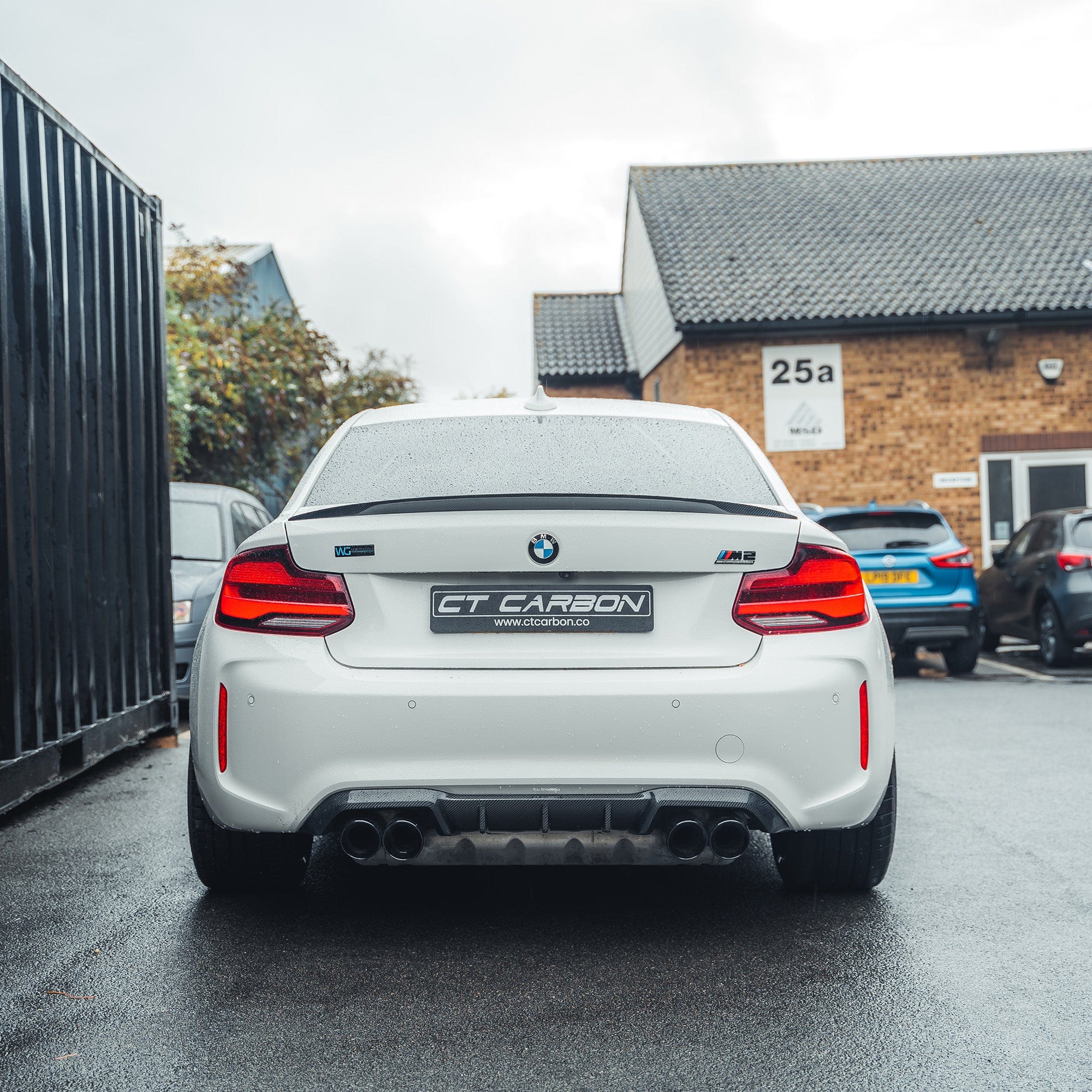 BMW M2 F87 M2C F22 carbon fibre spoiler by CT Carbon, showcasing sleek, aerodynamic design on a sporty car model.