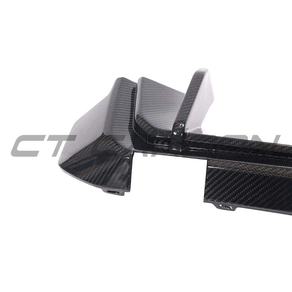 BMW M3 G80/G81 carbon fiber diffuser by CT Design, showcasing sleek black carbon fiber with aerodynamic design details.