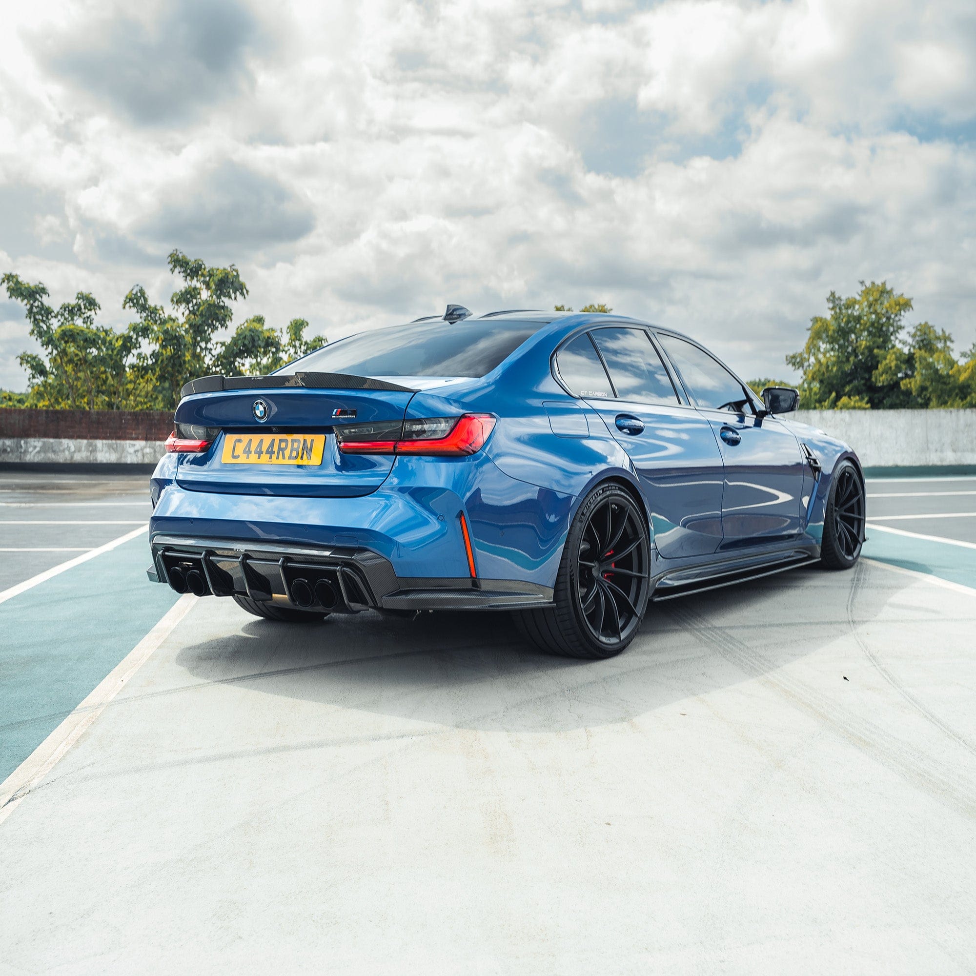 BMW M3 G80/G81 carbon fibre diffuser by CT Carbon, showcasing its sleek, lightweight design and textured finish.