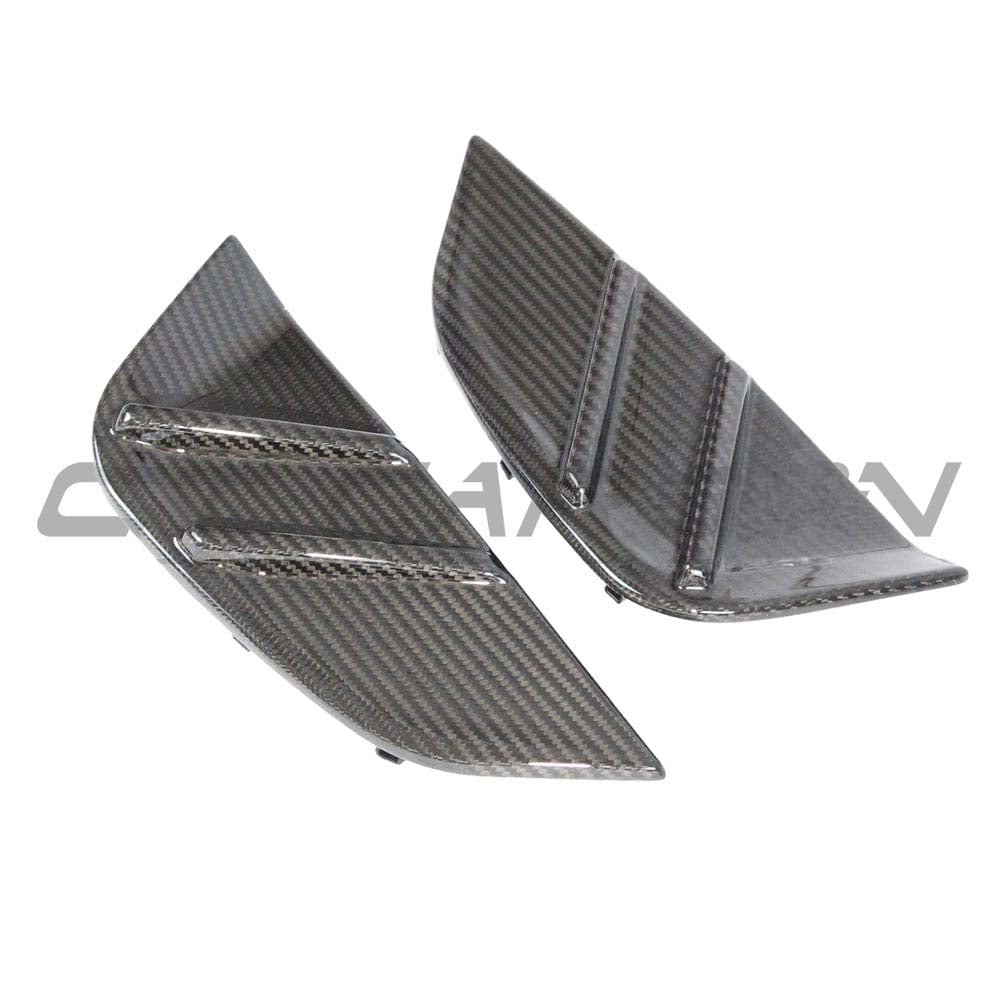 BMW M3 G80 G81 carbon fiber replacement side fender trim by CT Carbon, close-up of sleek, lightweight automotive accessories.