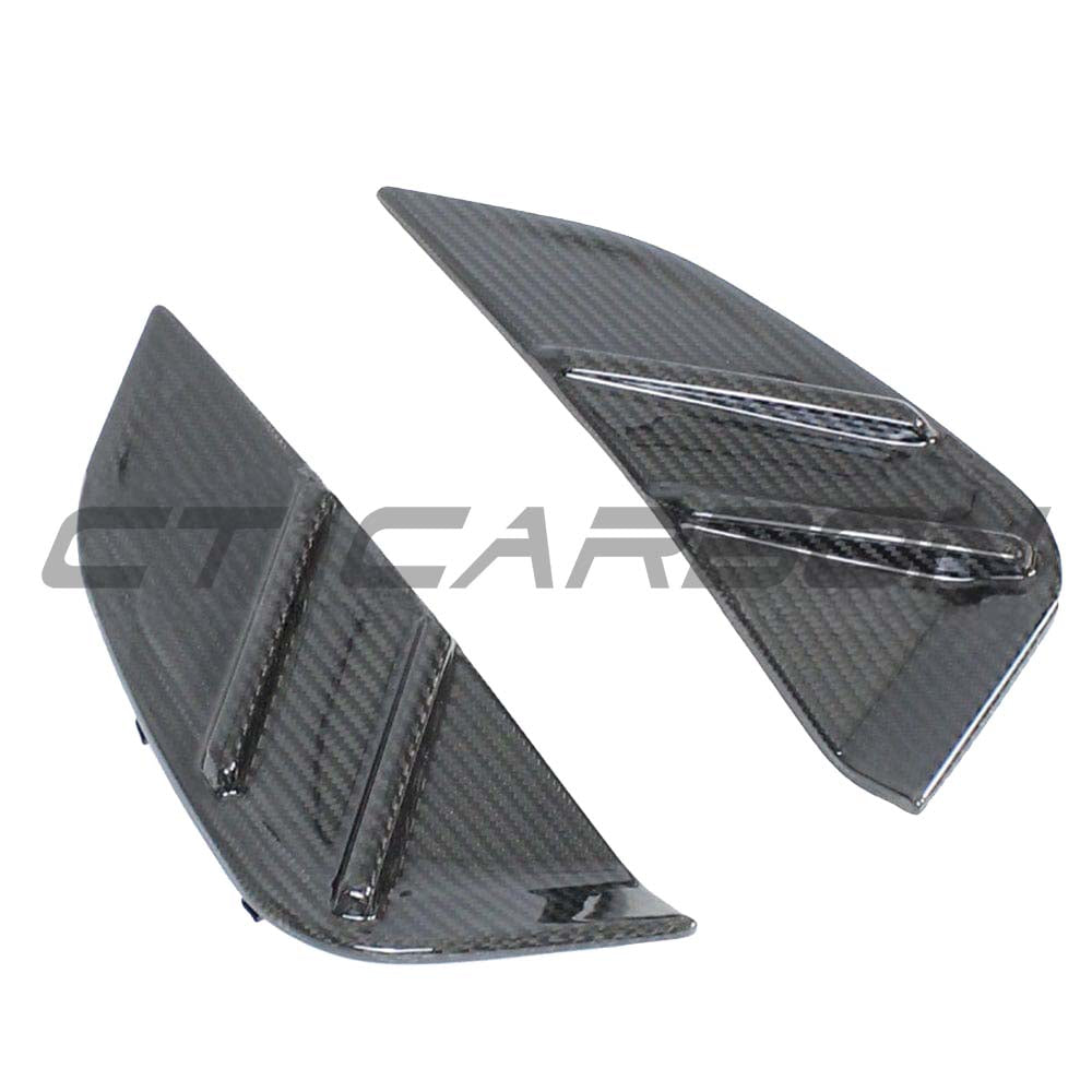 BMW M3 G80 G81 carbon fiber replacement side fender trim by CT Carbon, showcasing sleek, textured carbon fiber accessory.