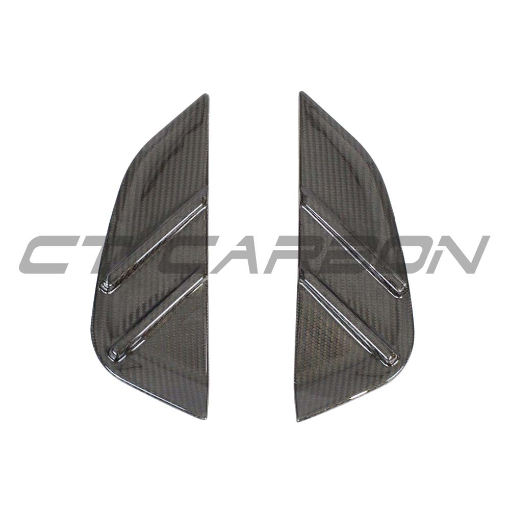 BMW M3 G80 G81 carbon fibre replacement side fender trim by CT Carbon, showcasing sleek black automotive accessory.