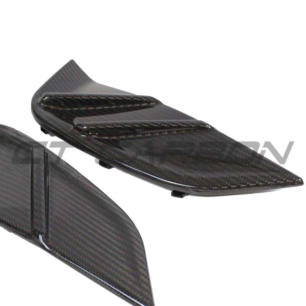 BMW M3 G80/G81 carbon fiber replacement side fender trim by CT Carbon, showcasing sleek, lightweight accessory with textured finish.