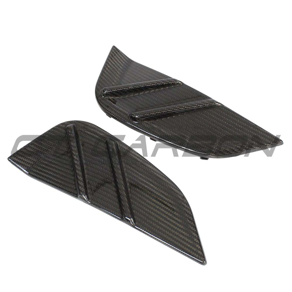 BMW M3 G80 G81 carbon fiber replacement side fender trim by CT Carbon, showcasing sleek, lightweight accessory detail.
