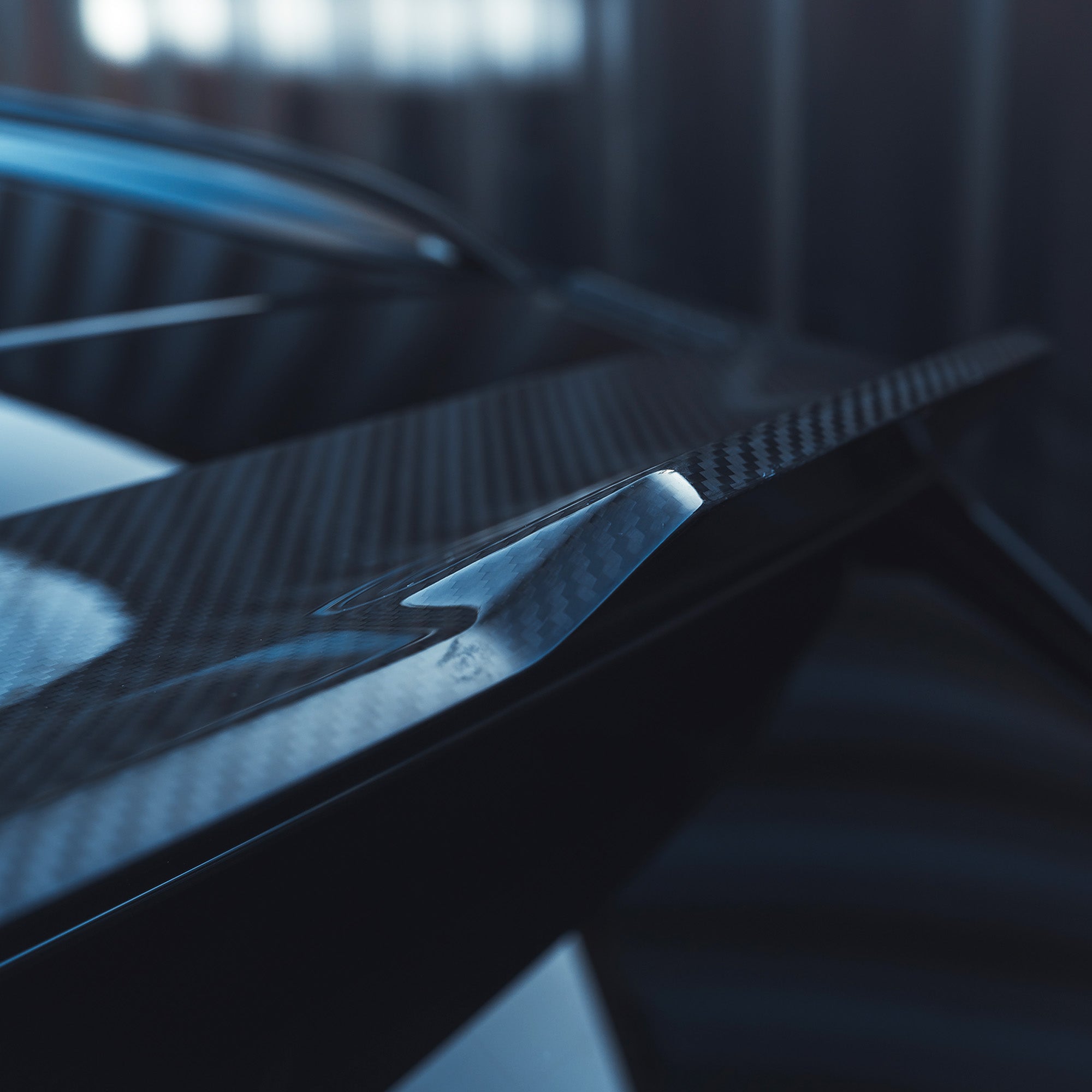 BMW M3 G81 G21 carbon fibre spoiler by CT Design, showcasing sleek aerodynamic design on the car's rear.