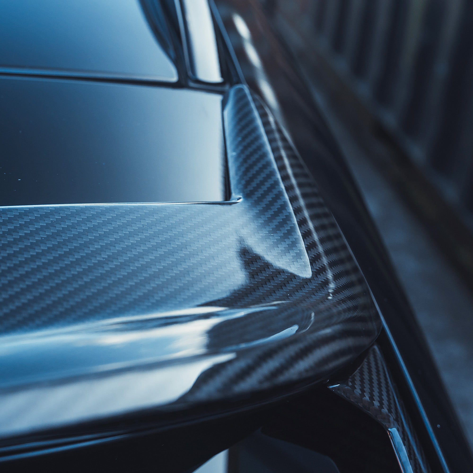 BMW M3 G81 G21 carbon fiber spoiler by CT Design, showing the sleek aerodynamic rear spoiler on the sports car.