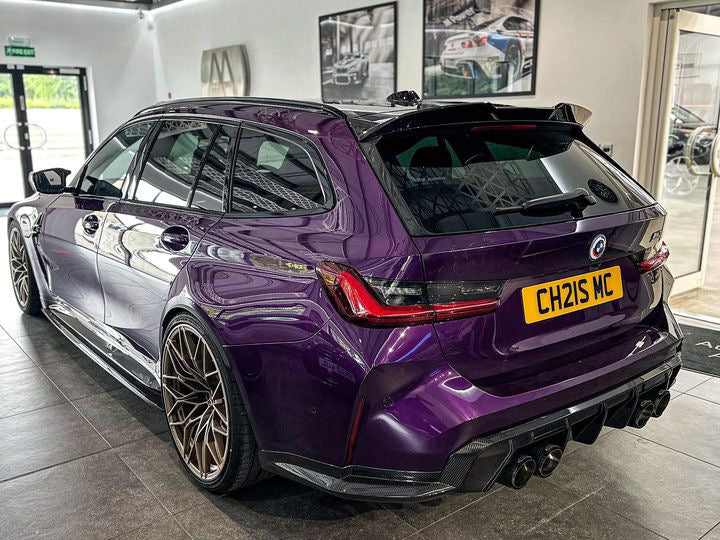 BMW M3 M4 G80 G81 G82 G83 carbon fibre diffuser trim accessory by CT Carbon, showcasing sleek, high-quality carbon fibre finish.