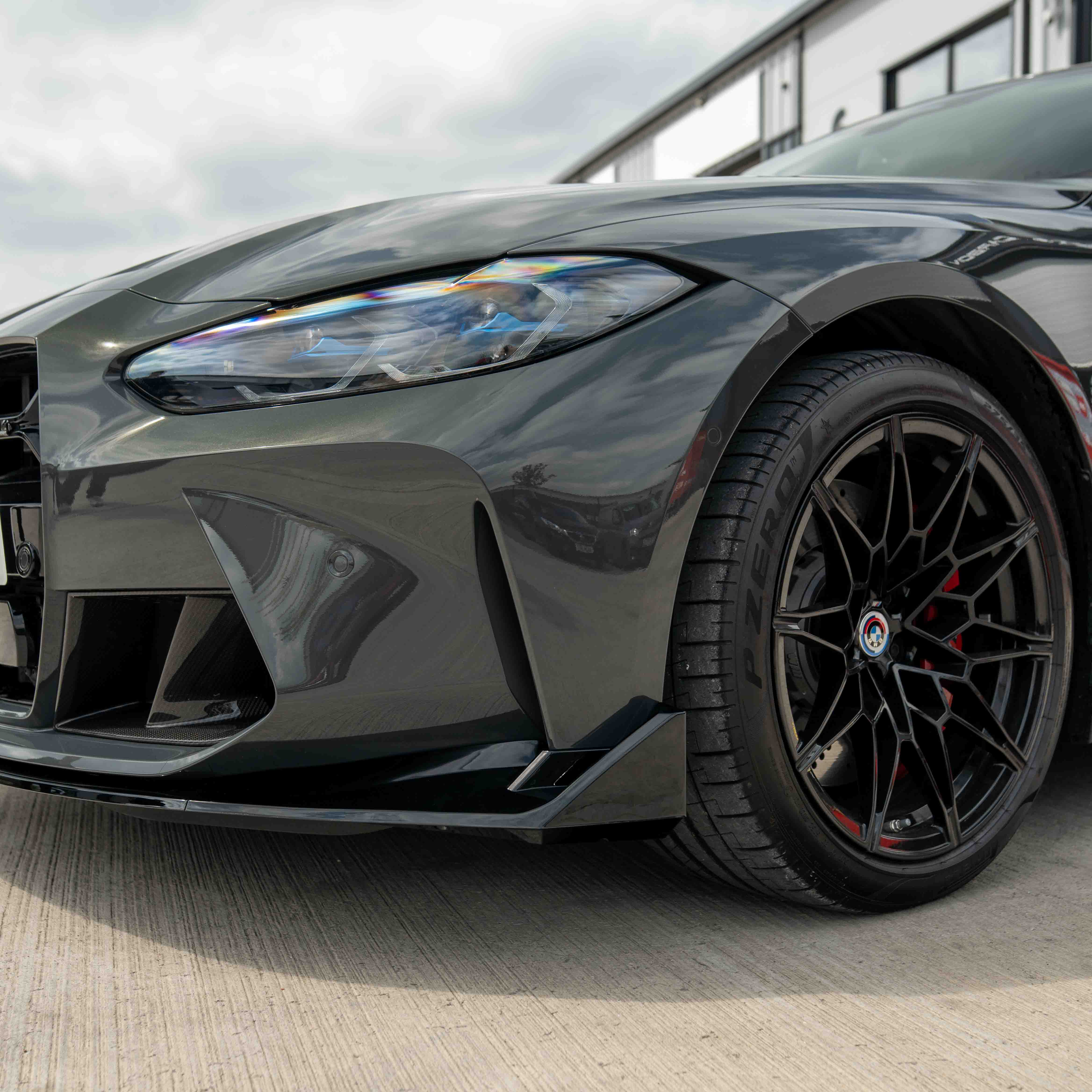 BMW M3 M4 G80 G81 G82 G83 CT Carbon gloss black splitter in CSL style, highlighting the sleek, aerodynamic design on the car.