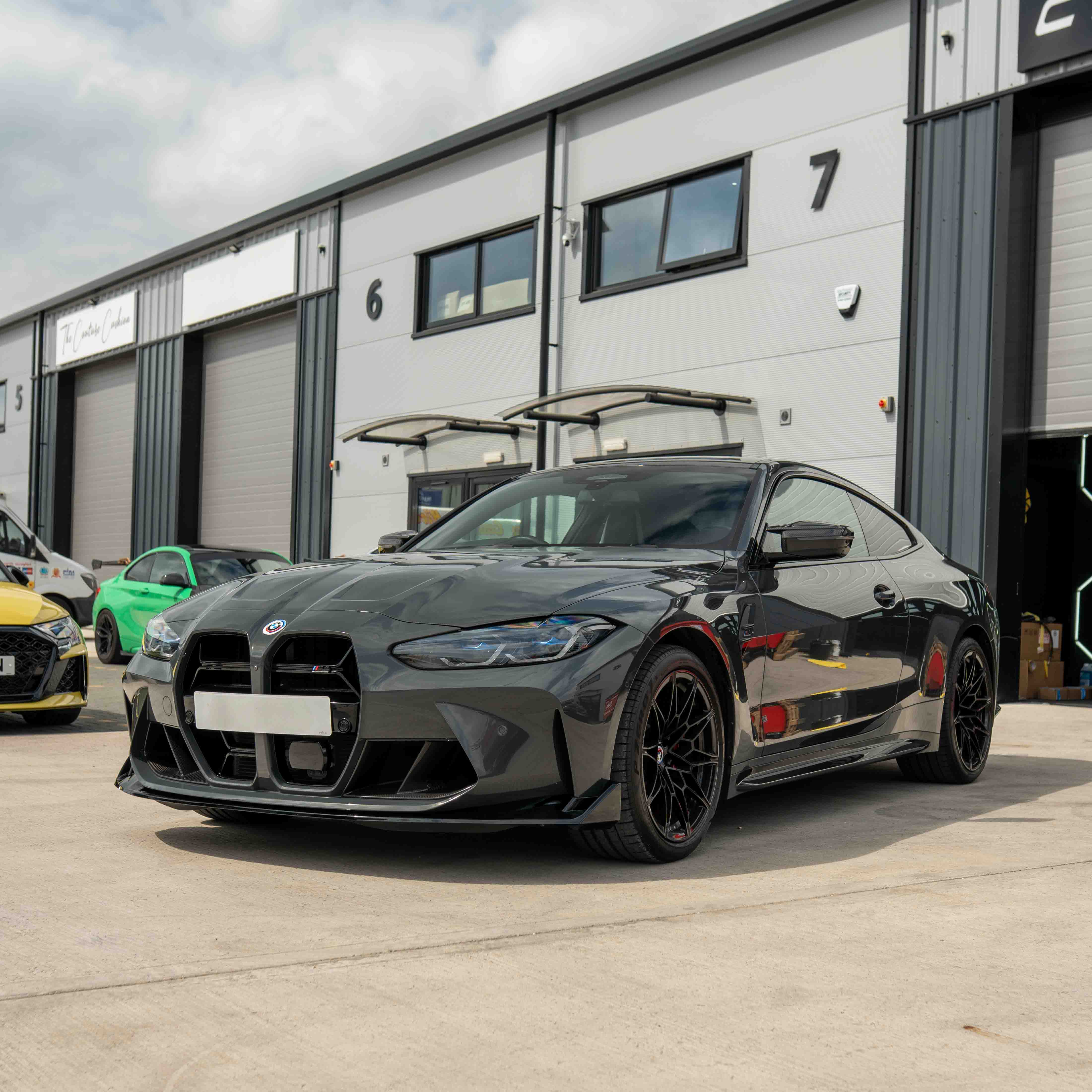 BMW M3 and M4 G80 G81 G82 G83 CT Carbon gloss black splitter in CSL style, showcasing its sleek, aerodynamic design.