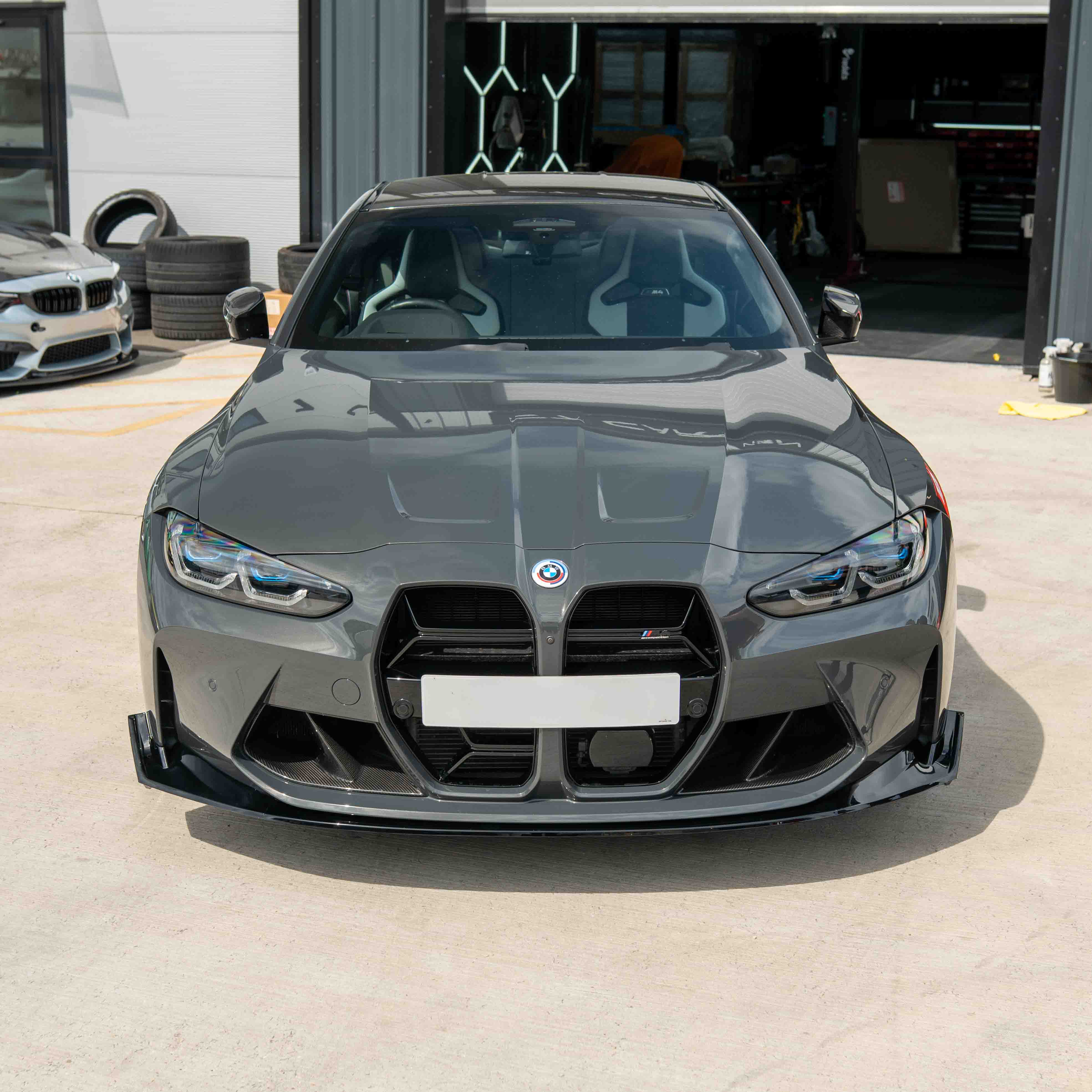 BMW M3 M4 G80 G81 G82 G83 CT Carbon gloss black splitter, CSL style, aerodynamic car body part for enhanced performance.