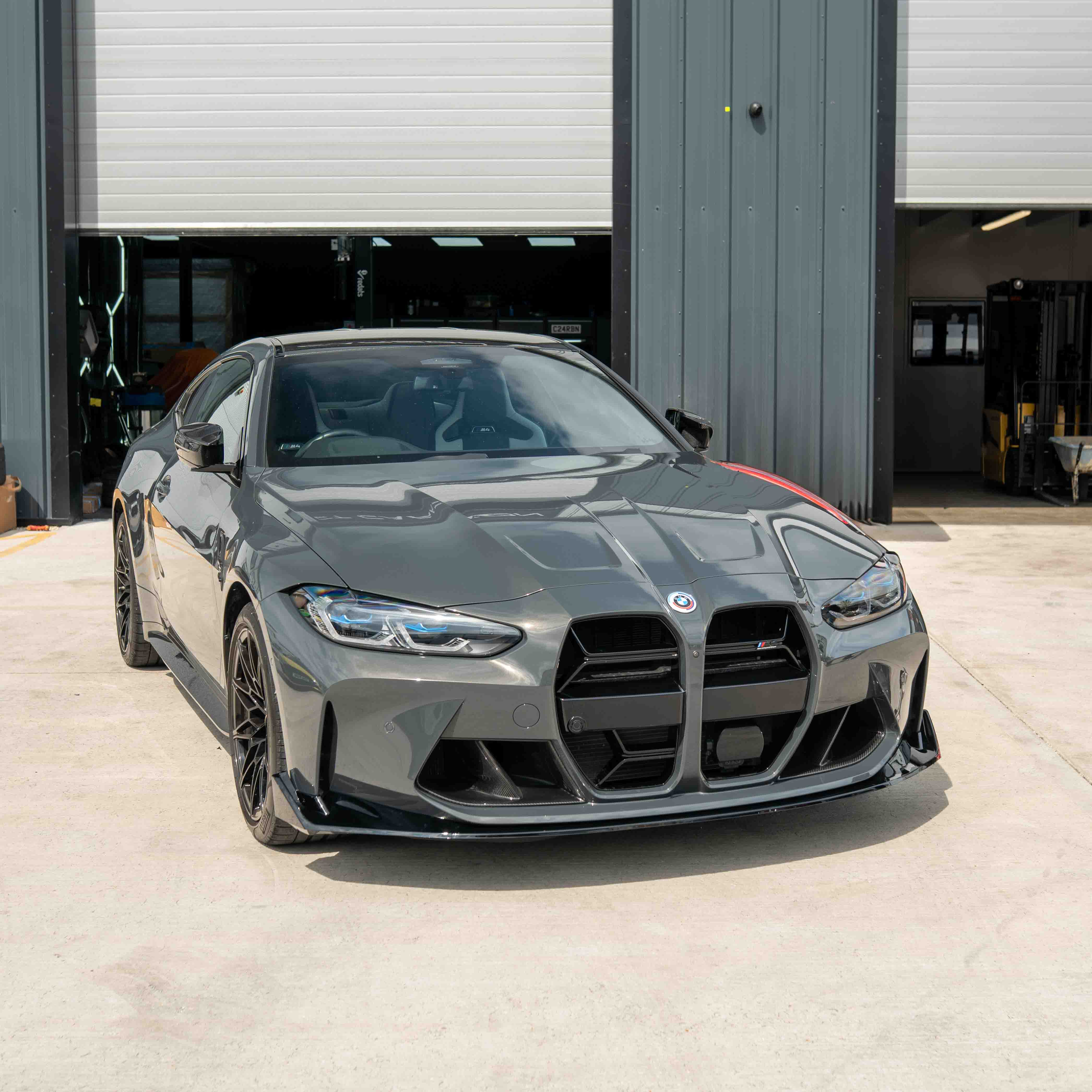 BMW M3 M4 G80 G82 G83 GLOSS BLACK CSL-Style Splitter by CT Carbon, showing the sleek aerodynamic front splitter.
