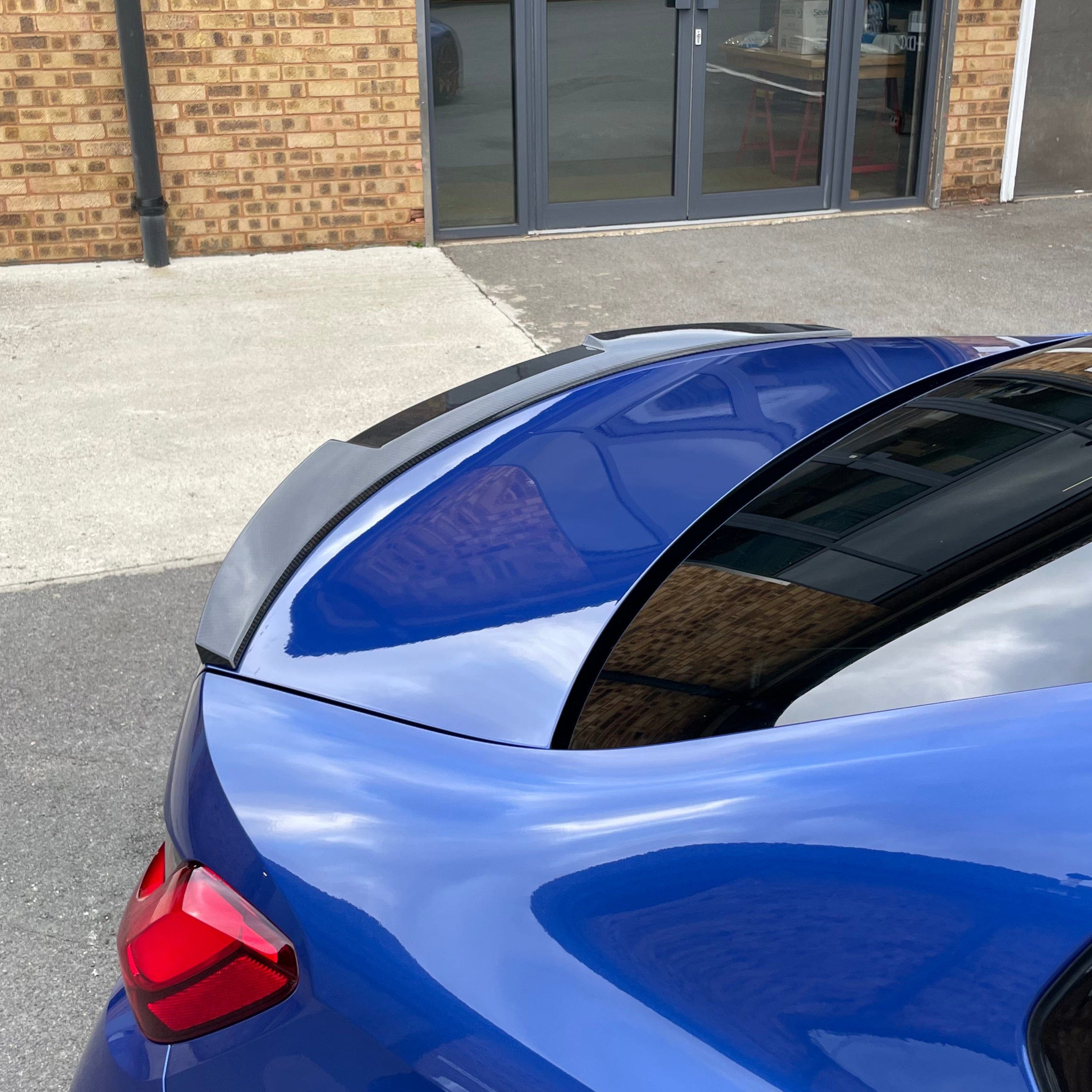 BMW M3 G80 G20 carbon fibre spoiler by CT Carbon, V8 style, sleek automotive accessory for sporty appearance.