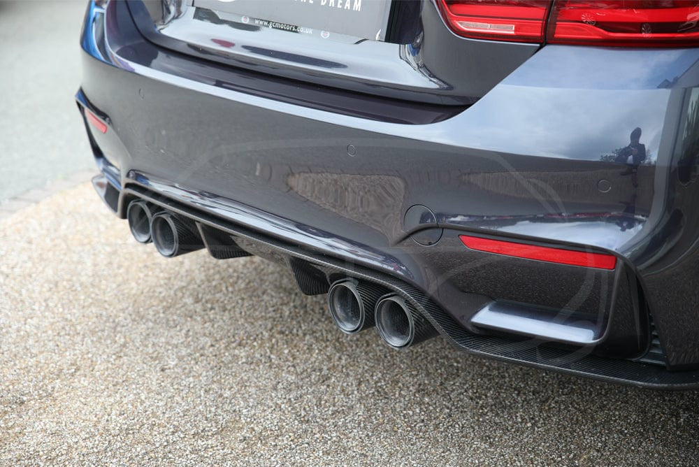 BMW M3 M4 F80 F82 F83 carbon fibre diffuser by CT Carbon, showing the sleek 3D style design on a sporty car.