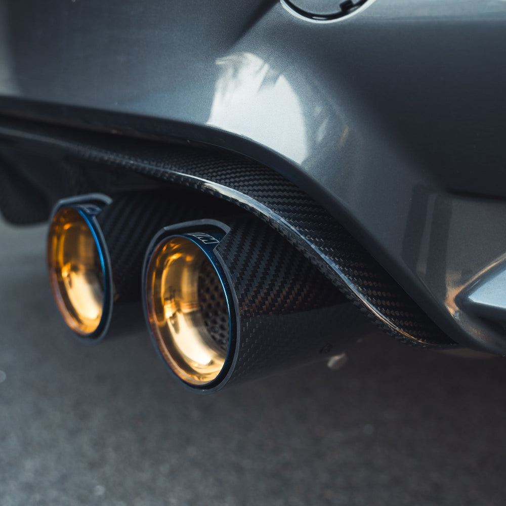 BMW M3 M4 F80 F82 F83 carbon fibre diffuser by CT Carbon, showing sleek V1 style with detailed carbon fiber finish.