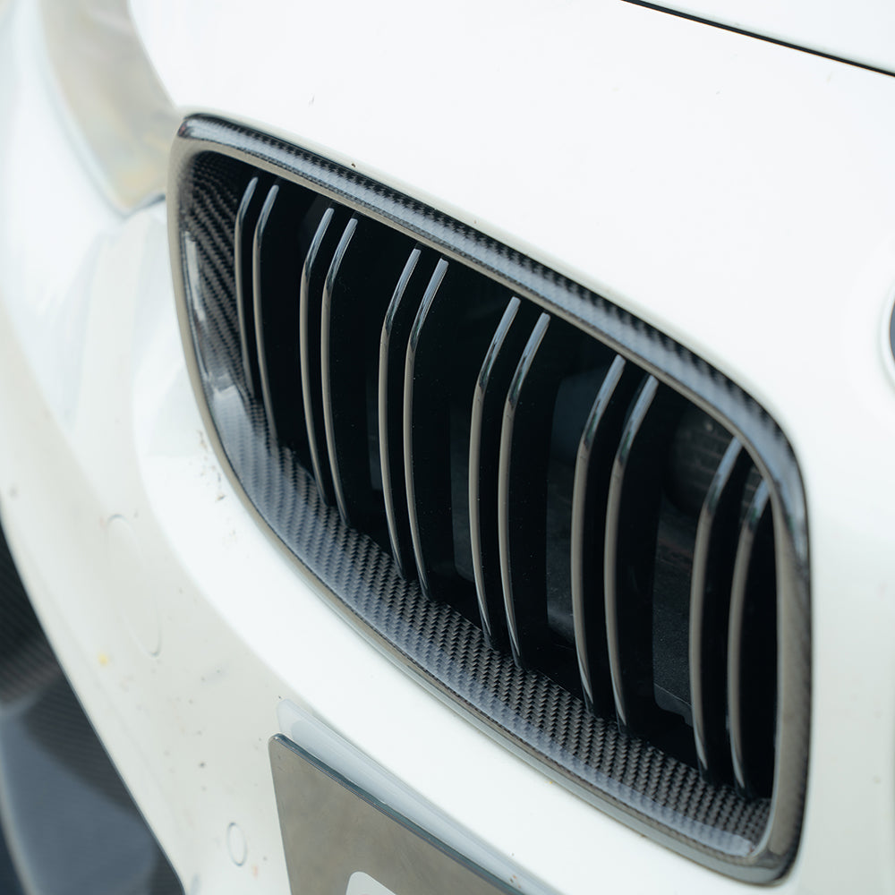 BMW M3 M4 F80 F82 F83 carbon fiber front grille by CT Carbon, showcasing sleek, lightweight, textured carbon fiber grille design.