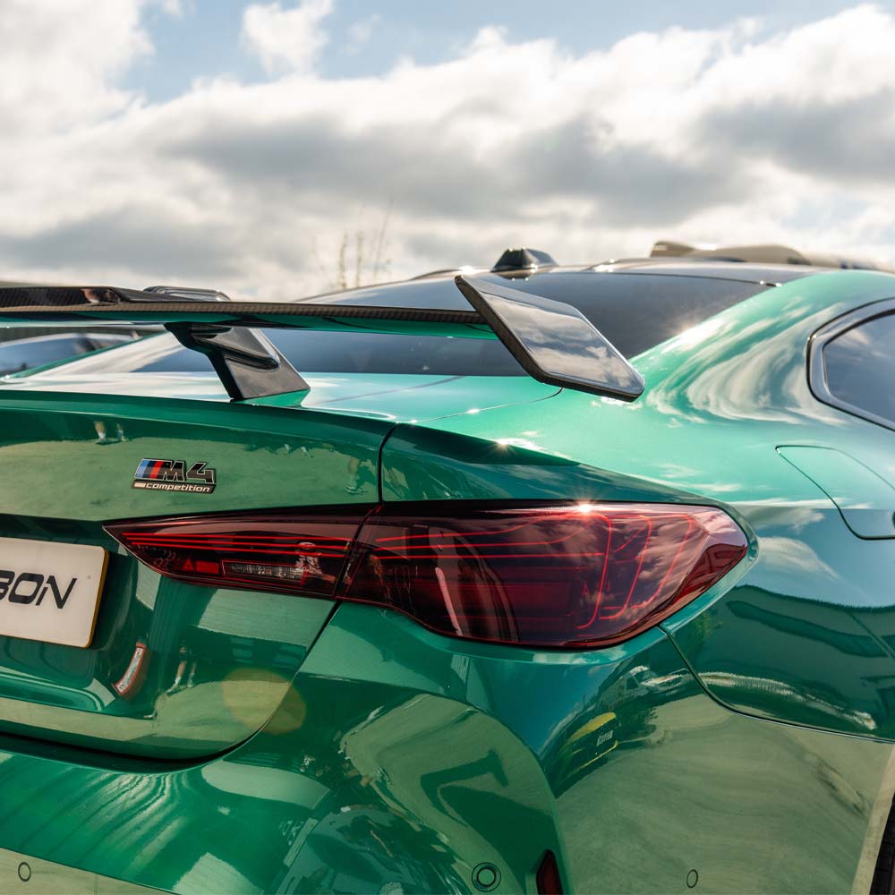 BMW G80 M3 and G82 M4 CT Carbon fiber spoiler wing for 2021+ models, showcasing sleek, aerodynamic design and carbon fiber finish.