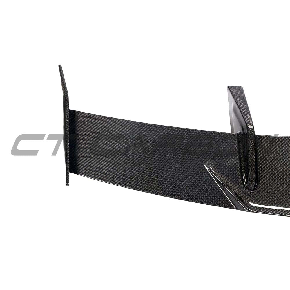 BMW G80 M3 and G82 M4 carbon fibre wing spoiler by CT Carbon, featuring a sporty MP style design on a sleek car image.