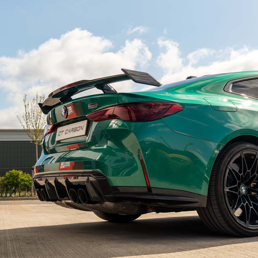 BMW G80 M3 and G82 M4 carbon fibre spoiler by CT Carbon, featuring a sleek MP style wing on a sporty coupe.