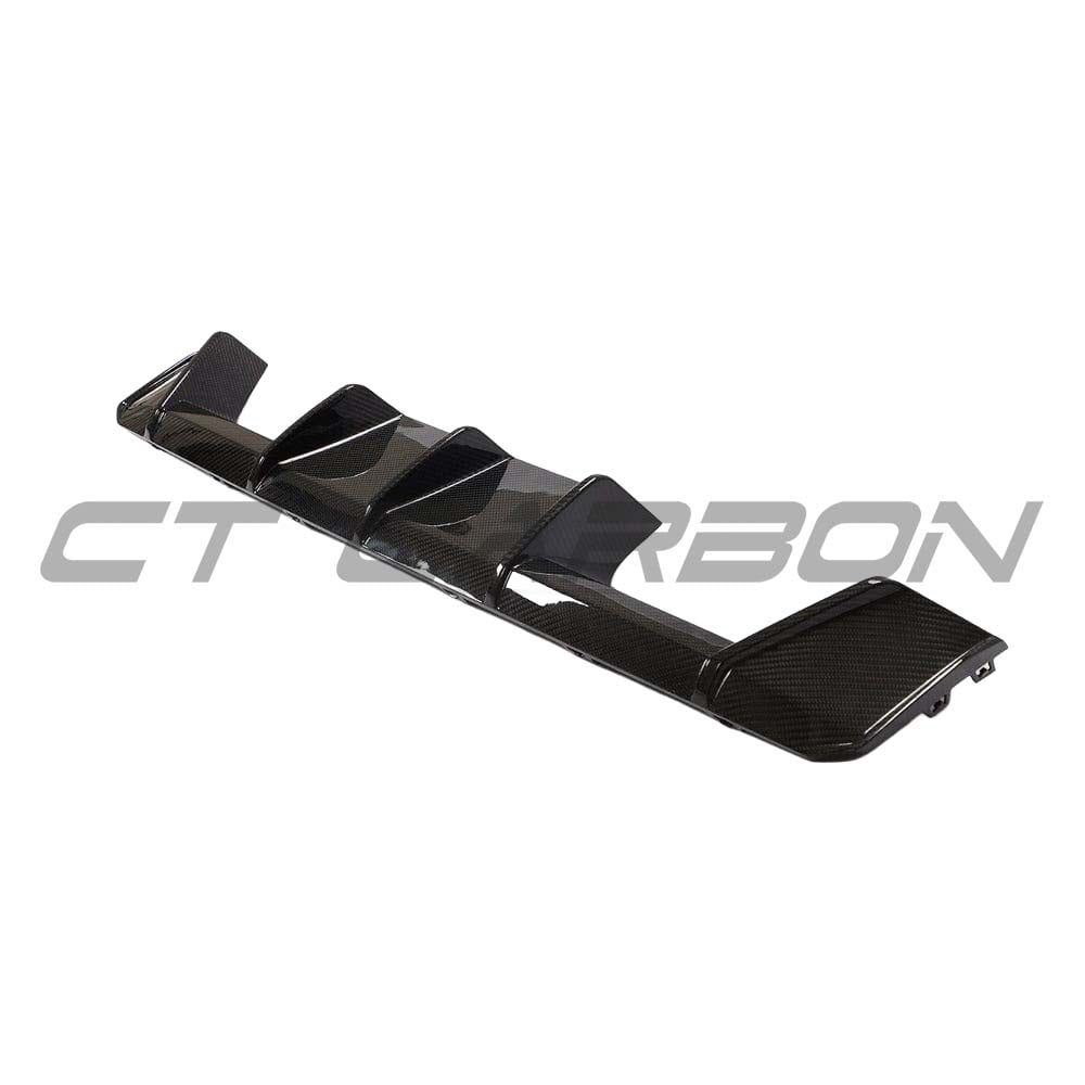 BMW M3 M4 G80 G82 carbon fiber diffuser by CT Carbon, V2 style, showcasing sleek aerodynamic design for sporty performance.