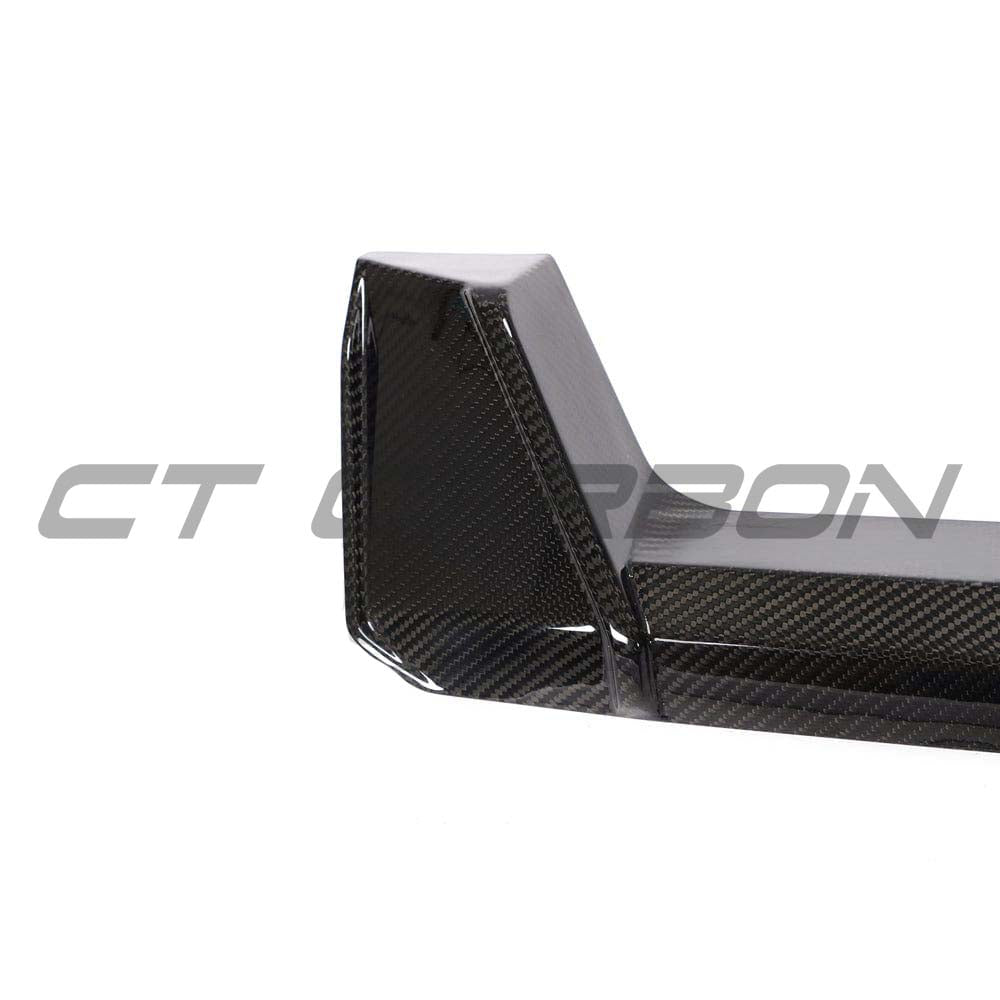 BMW M3 M4 G80 G82 G83 carbon fibre diffuser by CT Carbon, sleek V2 style with detailed carbon fiber weave and aerodynamic design.