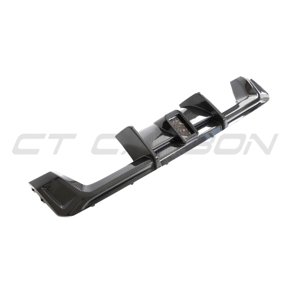 BMW M3 M4 G80 G82 G83 carbon fibre diffuser with LED lights, V3 version, designed by CT Carbon, showcasing sleek aerodynamic design.