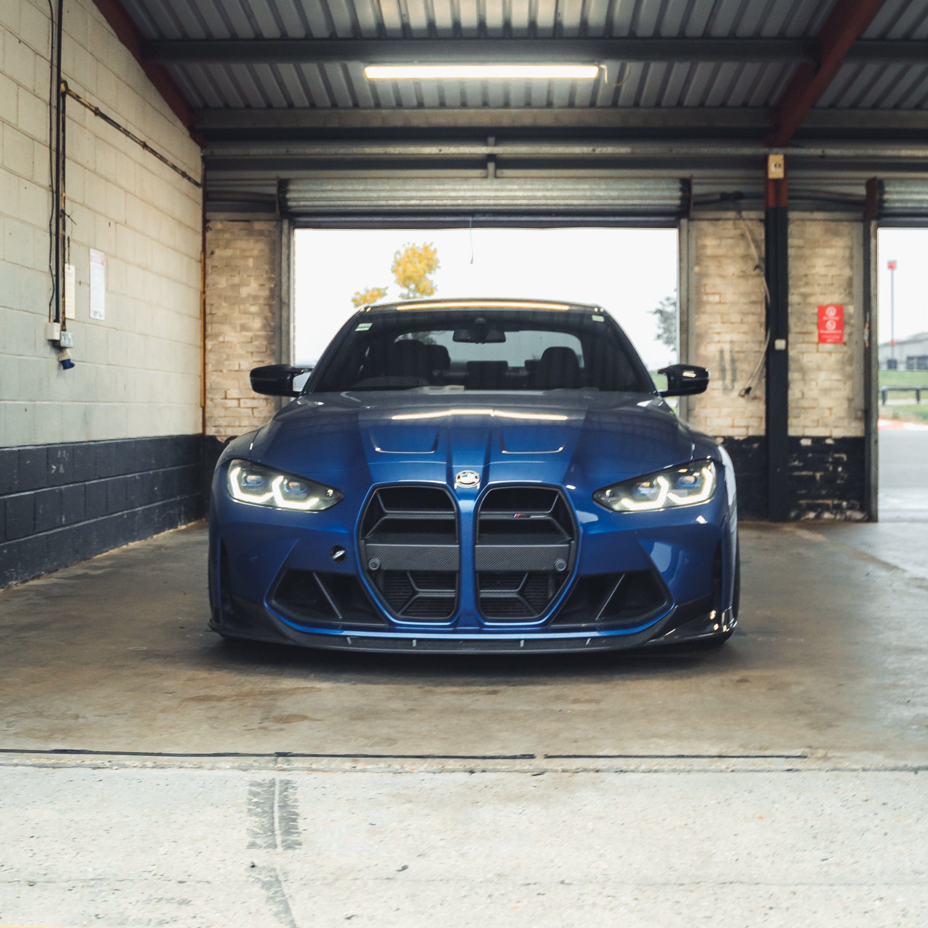 BMW M3 M4 G80 G82 G83 carbon fibre grille by CT Carbon, showing sleek black mesh design without accessories.