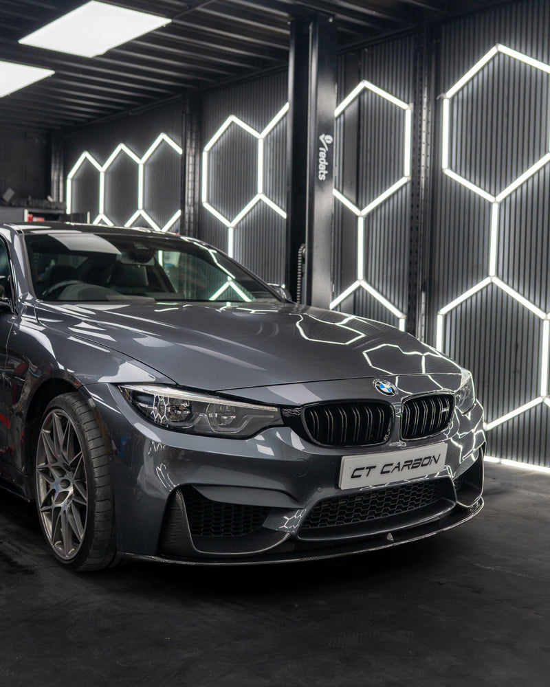 BMW F82 M4 coupe full carbon fibre kit by CT Carbon, featuring MP-style aerodynamic components and sleek carbon fiber finish.