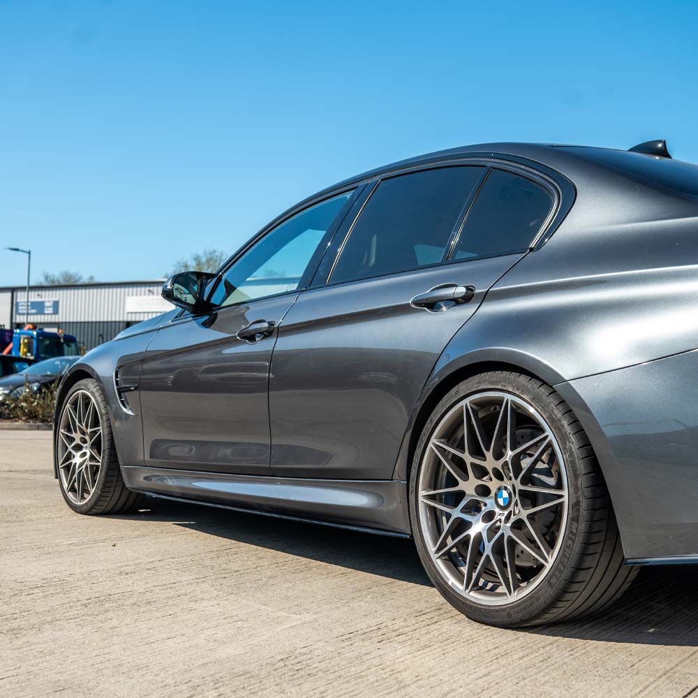 BMW M3 F80 2014-2020 CT Carbon full gloss black kit, showing exterior car parts with a sleek, shiny black finish.