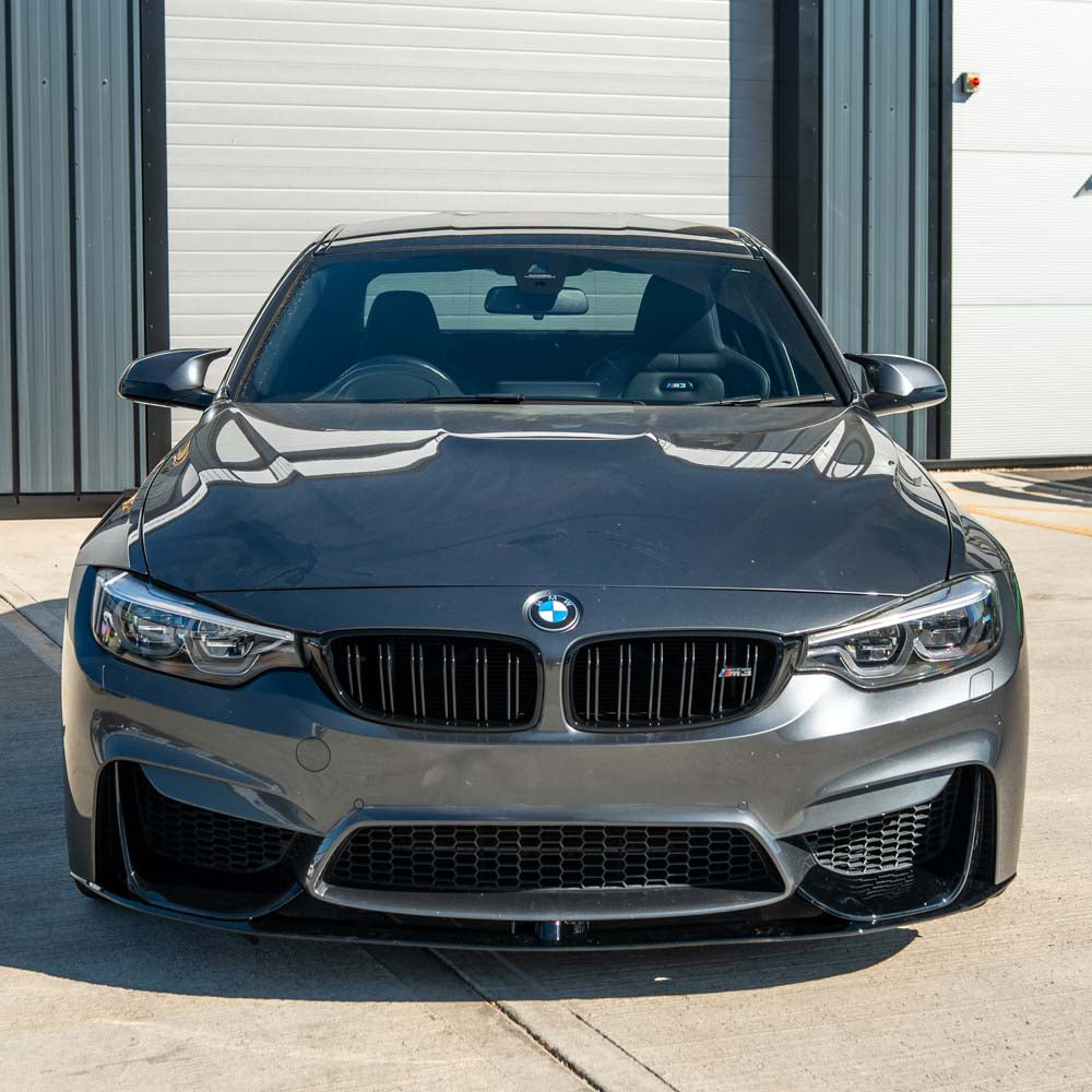 BMW M3 F80 2014-2020 CT Carbon full gloss black kit including body parts and accents on a car.
