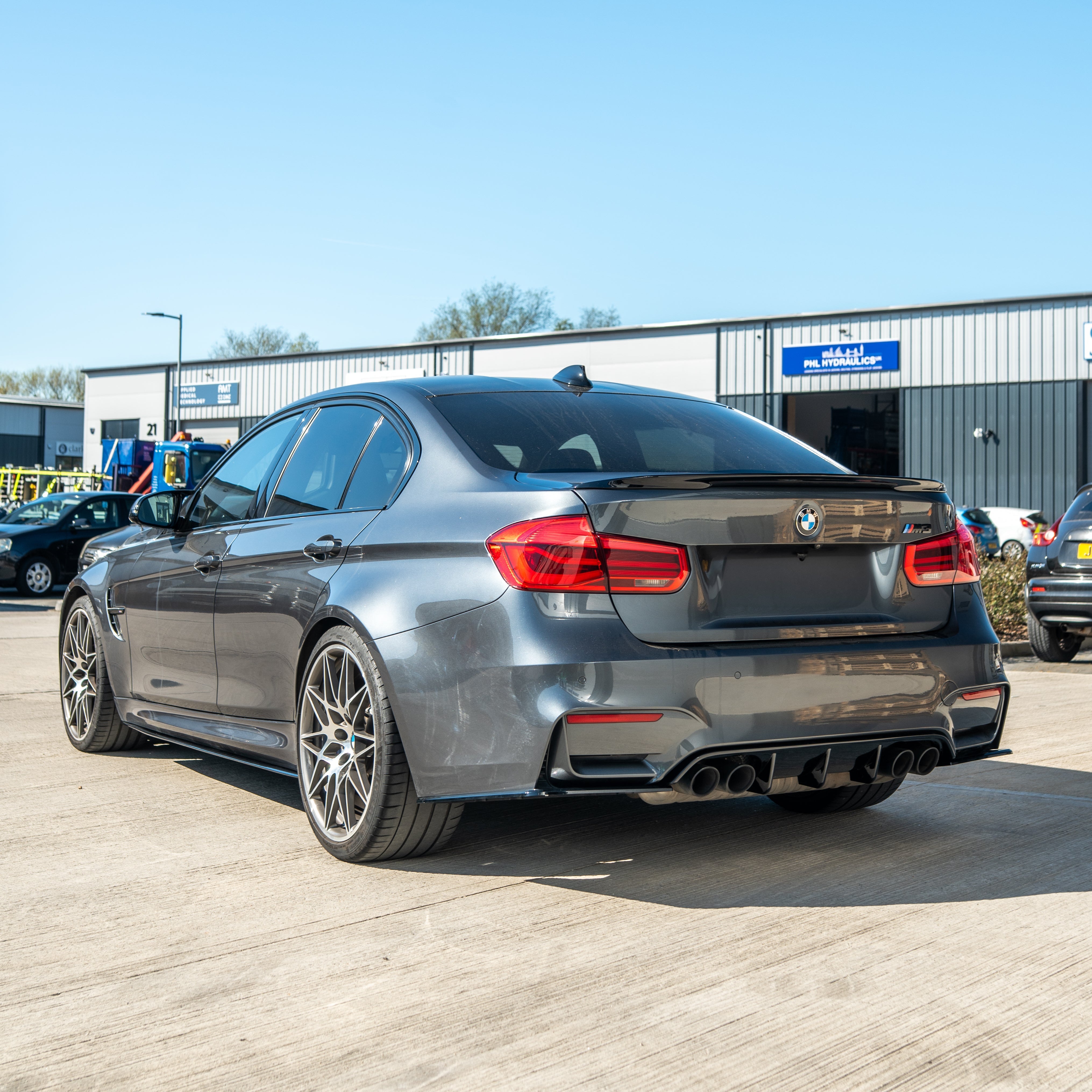 BMW M3/M4 F80/F82/F83 GLOSS BLACK V STYLE diffuser by CT Carbon, showing the sleek, glossy aerodynamic rear bumper component.