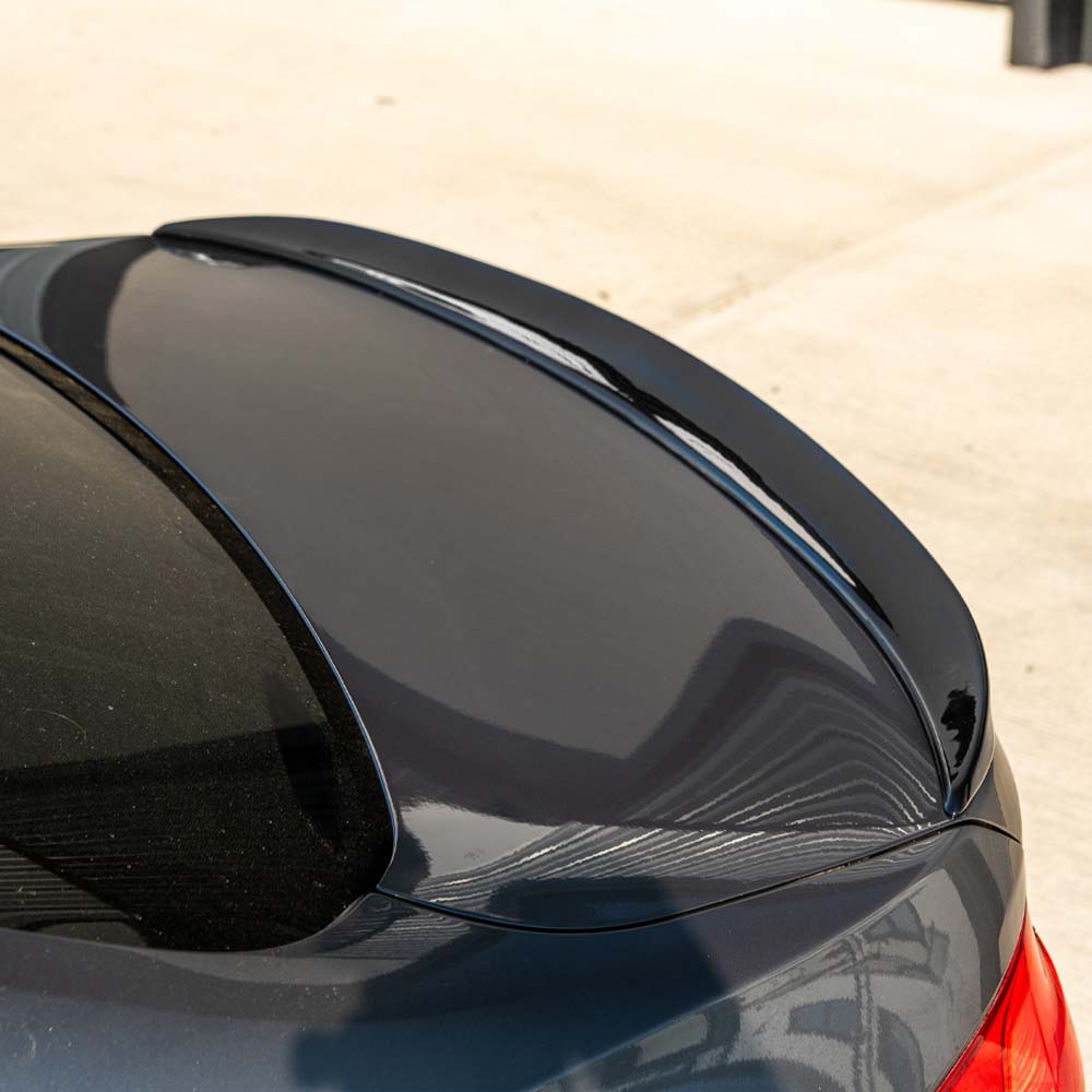 BMW M3 F80 full gloss black kit by CT Carbon, showing the sleek, shiny black exterior parts on a coupe model.