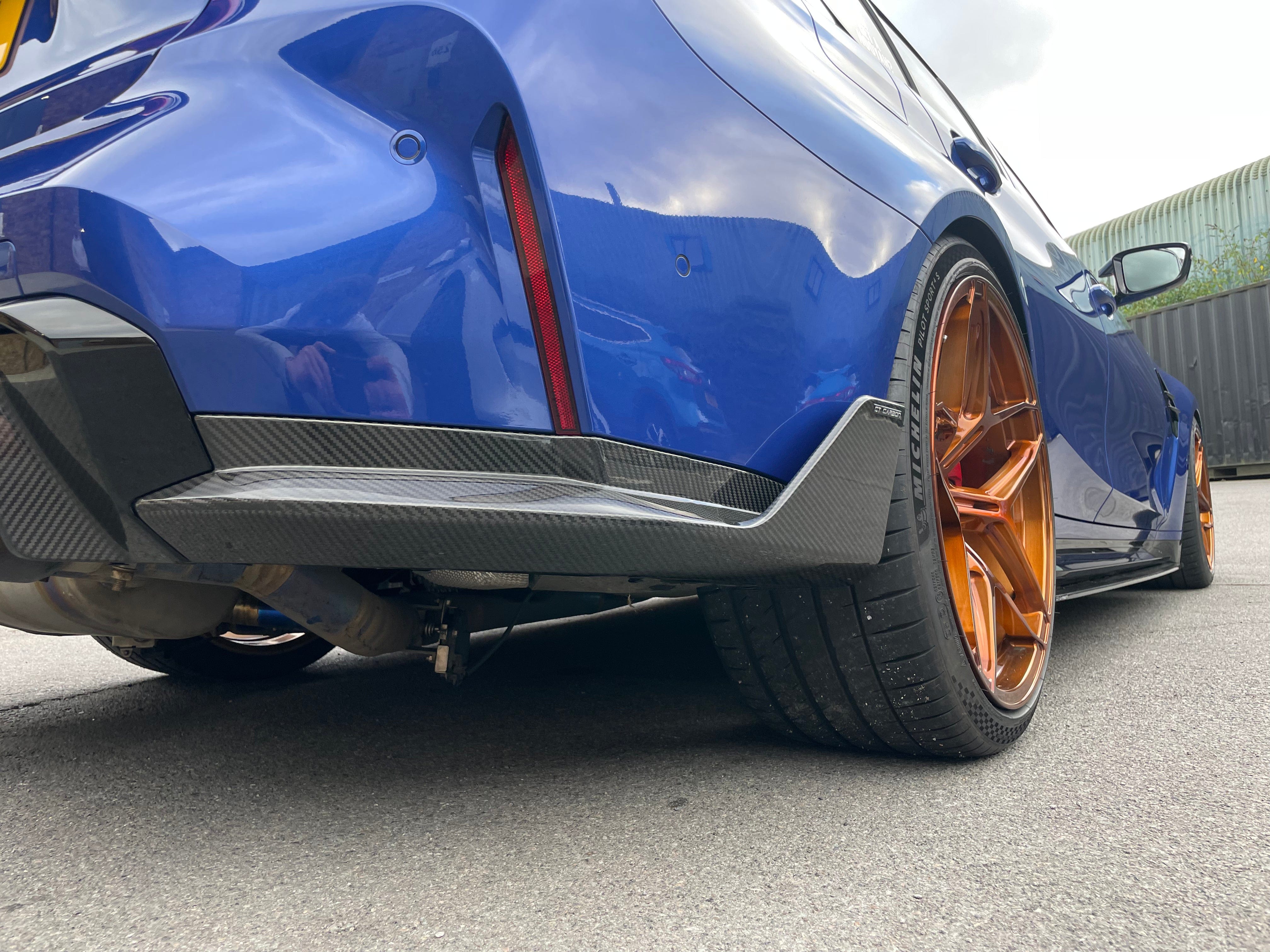 BMW M4 G82 G83 carbon fibre rear bumper corners by CT Carbon, MP style accessories for enhanced sporty look.