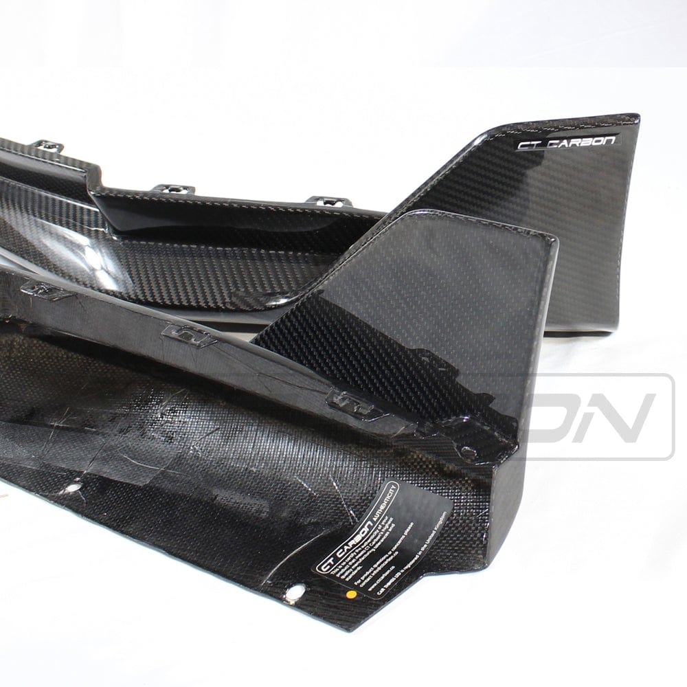 BMW M4 G82/G83 carbon fibre rear bumper corners by CT Carbon, showcasing sleek MP style accessory for enhanced rear look.