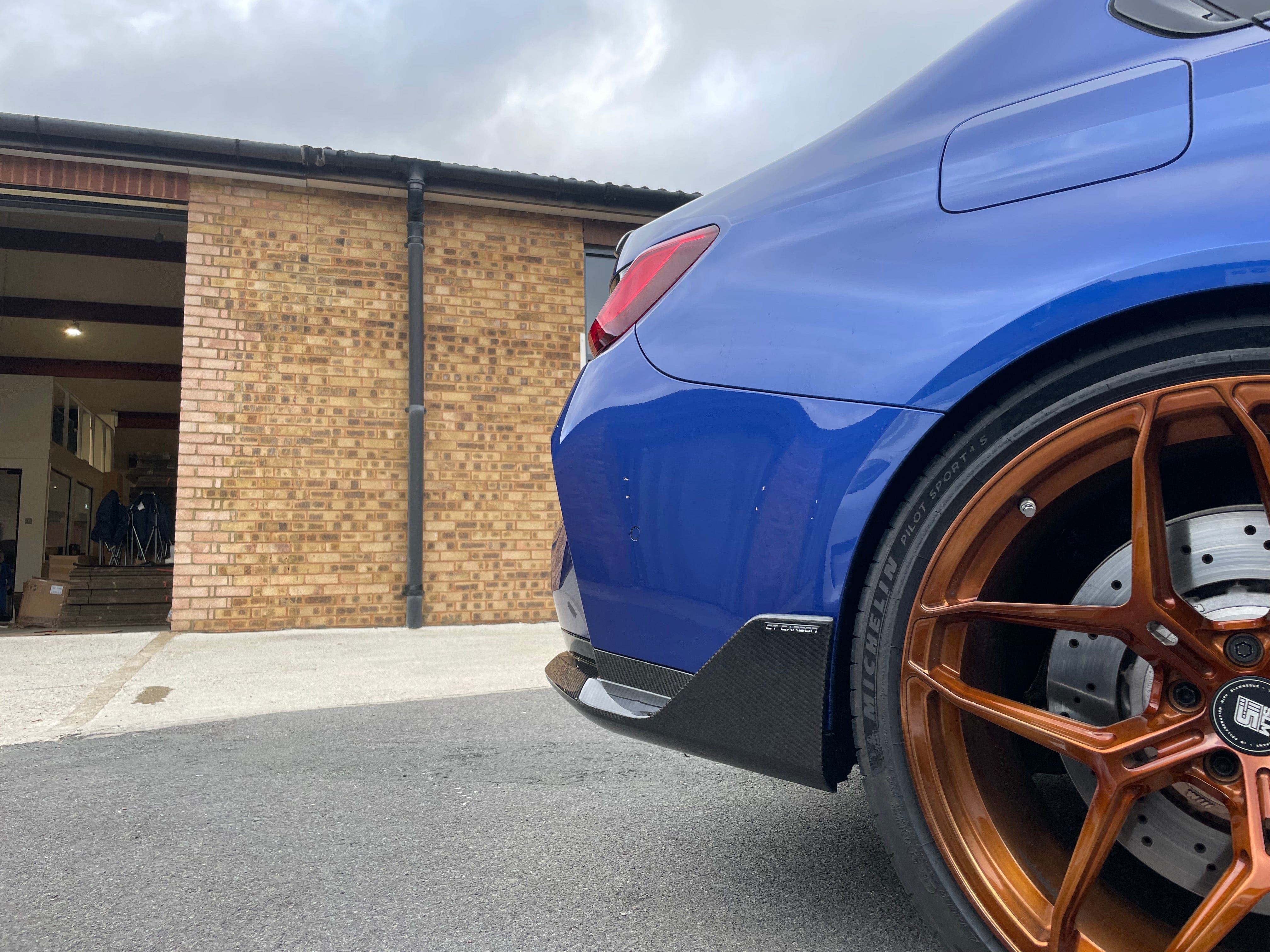 BMW M4 G82 G83 carbon fibre rear bumper corners by CT Carbon, stylish accessories for enhanced rear end appearance.